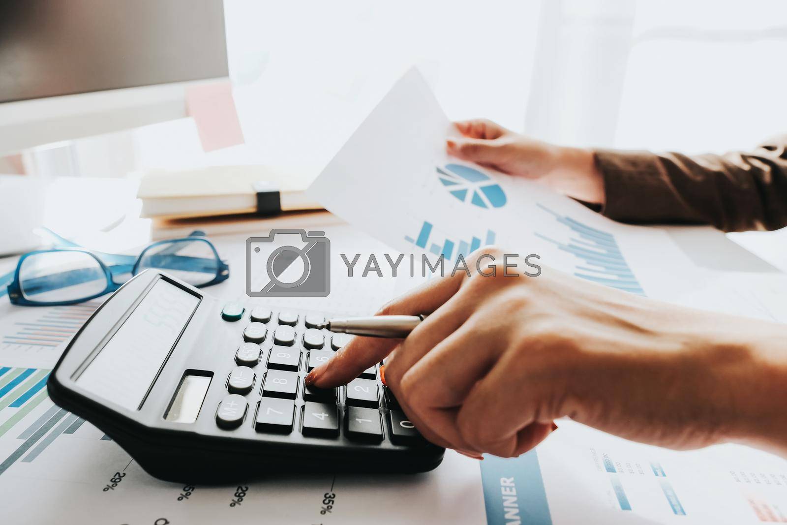 Businessman Accounting Counting with calculator and financial document report at home.