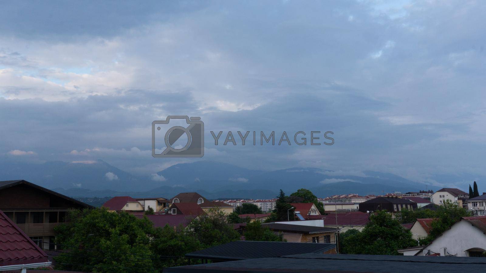 SOCHI, RUSSIA - JUNE, 06, 2021: Mountain view near Sochi Adler, outskirts of the city . Cloudy day in the south of Russia