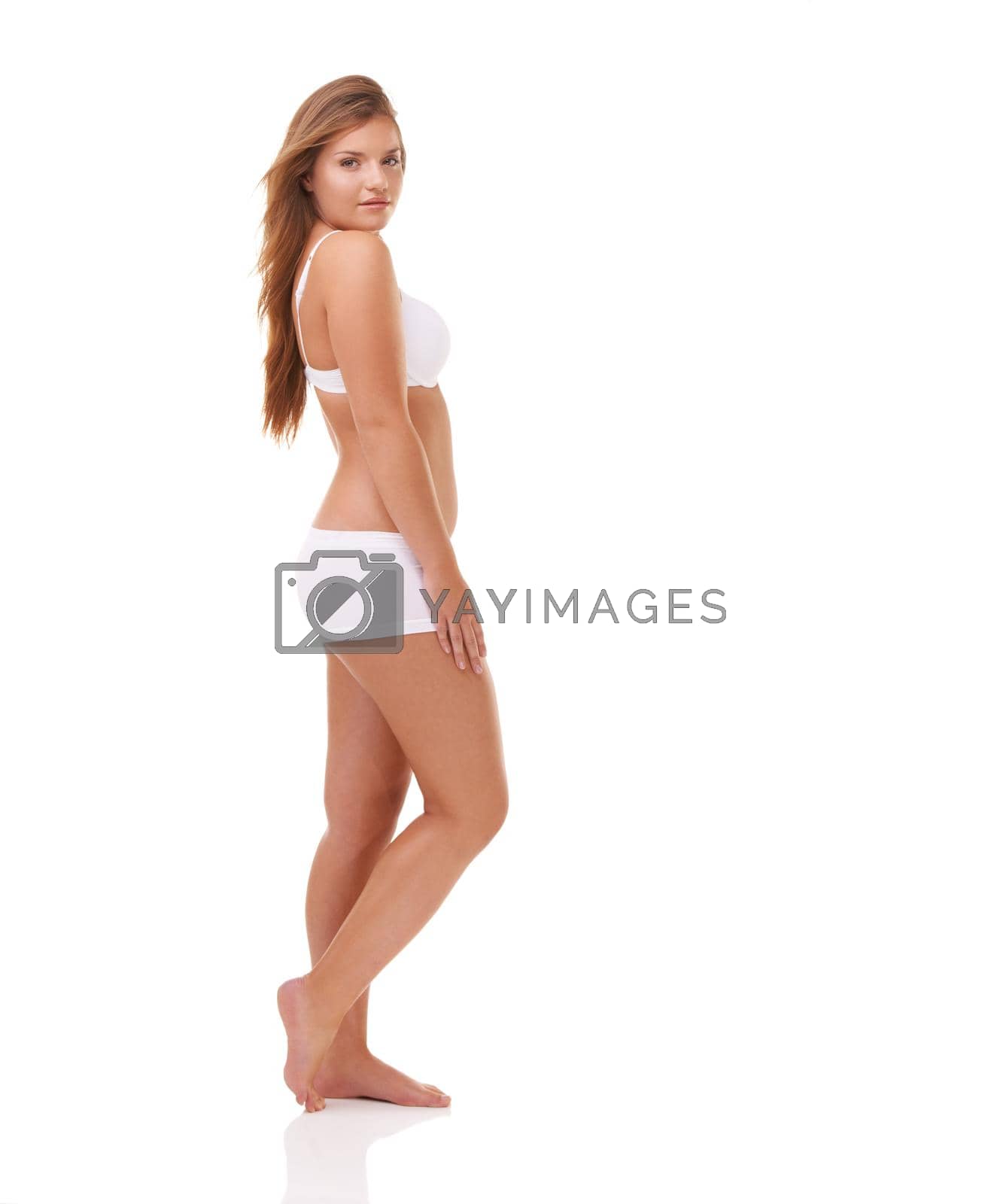 Full-length portrait of a confident young woman posing in her underwear