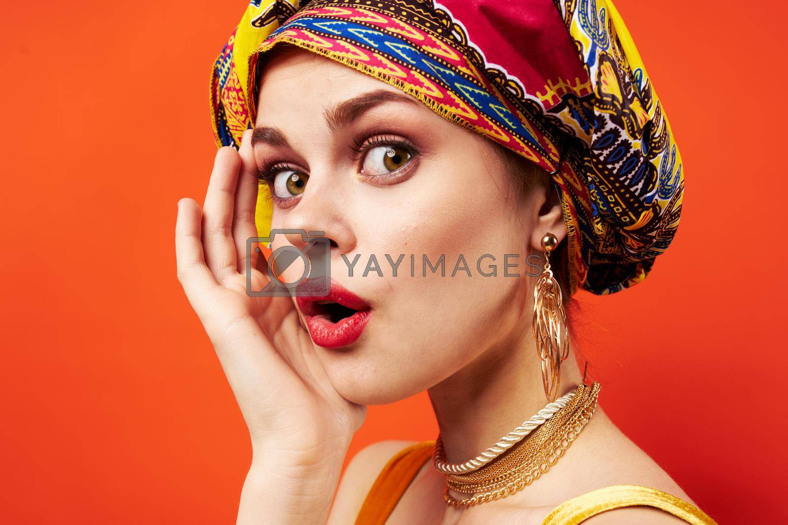 Royalty free image of cheerful woman multicolored shawl ethnicity african style isolated background by SHOTPRIME