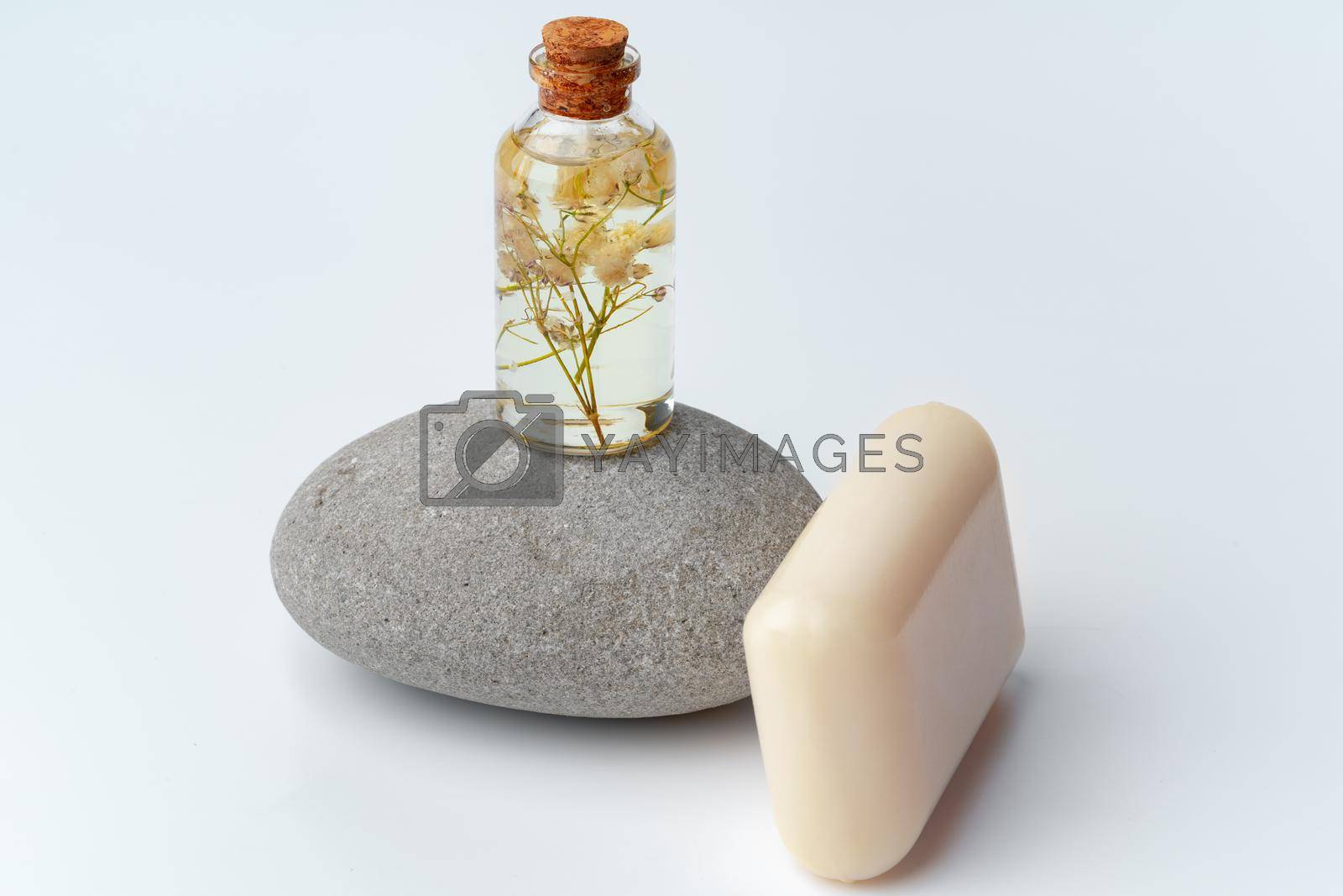 Spa stones and soap on white background, close up