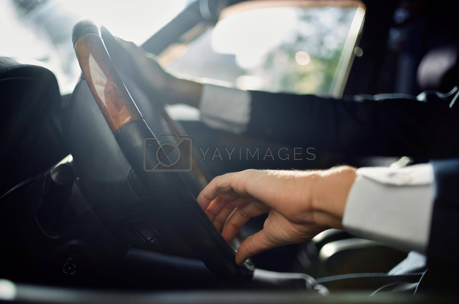 businessmen Driving a car trip luxury lifestyle communication by phone. High quality photo