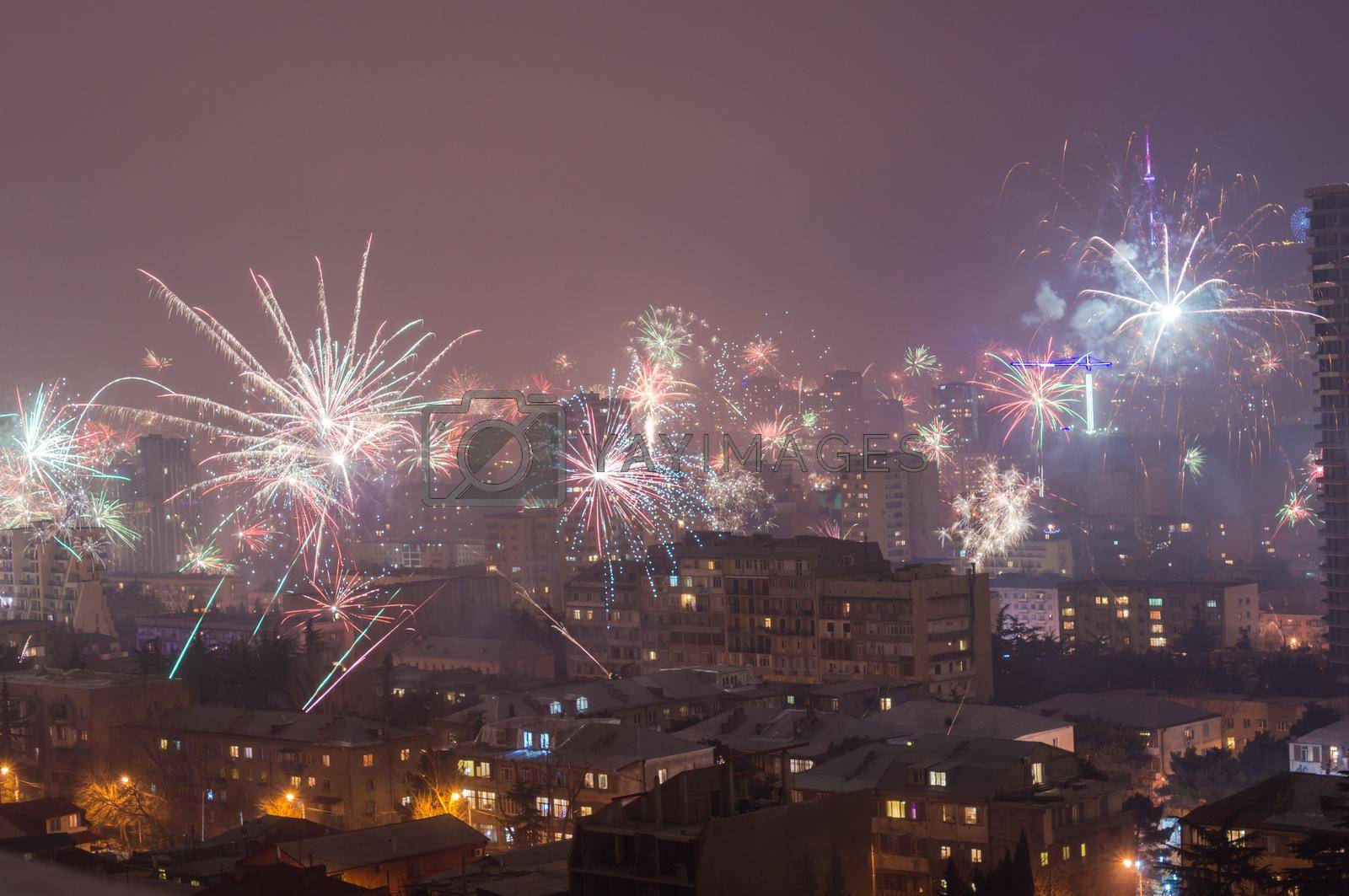 TBILISI, GEORGIA - JAN 01: IlluminatIion and fireworks at New Year 2017 midnight in capital city of Republic of Georgia over the central part of Tbilisi, on January  01, 2017.