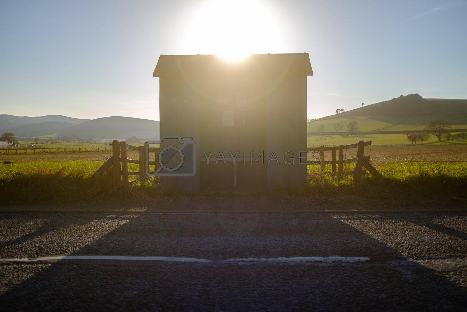 The Sun Setting Over A Rural Bus Stop In Scotland