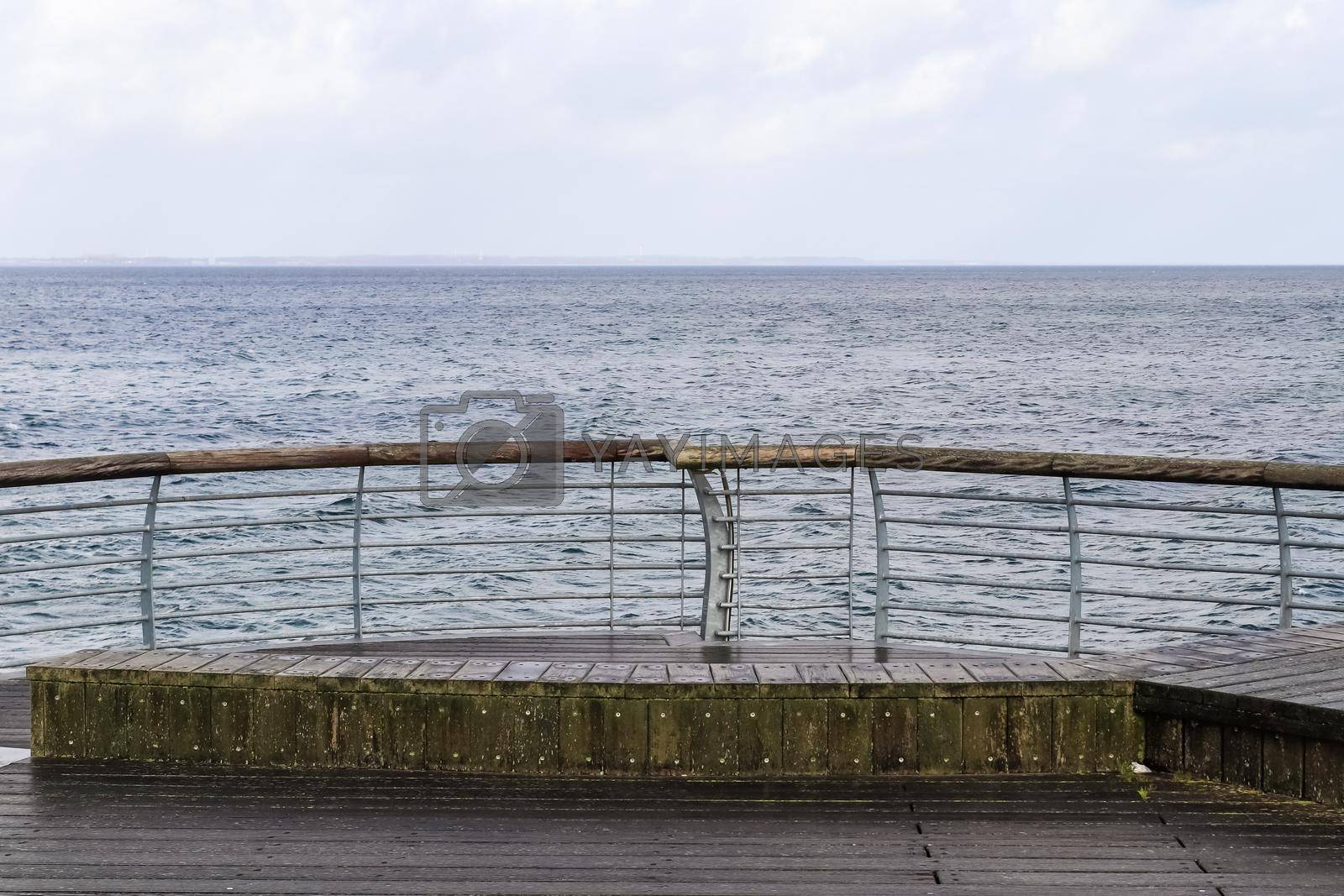 Royalty free image of Niendorf, Germany - 30.January 2022: View of the stormy Baltic Sea at a pier in Niendorf on Timmendorfer Strand. by MP_foto71