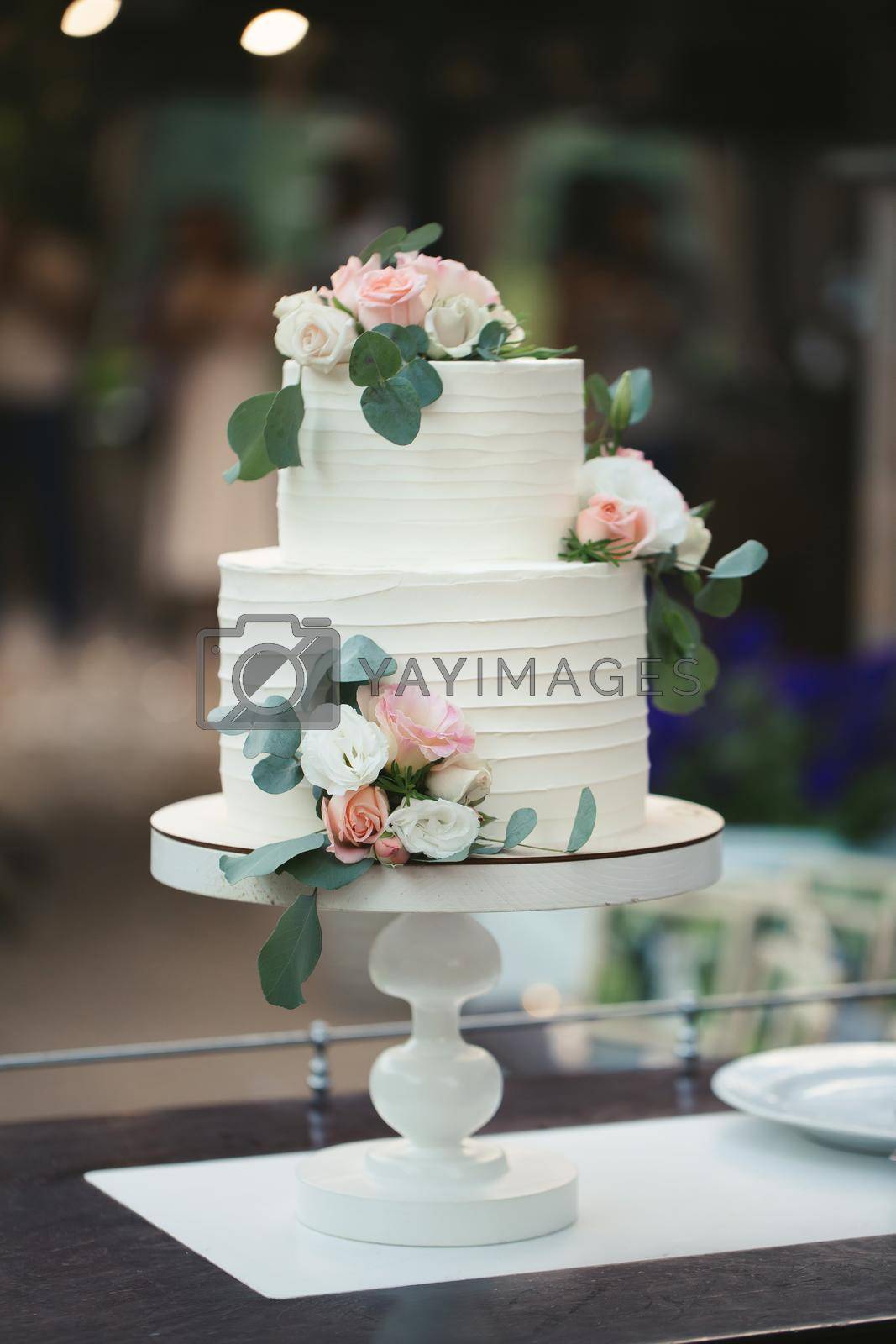Royalty free image of Beautiful wedding cake for the newlyweds at the wedding. A birthday cake at a banquet by StudioPeace
