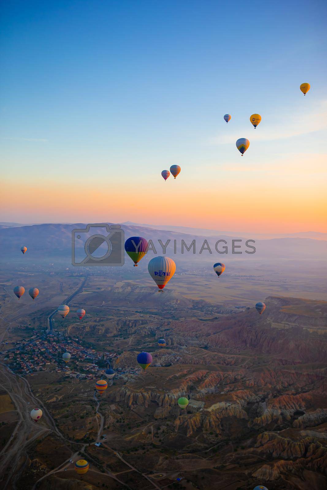 GOREME, TURKEY - SEPTEMBER 18. 2021: Hot air balloon fly over Cappadocia is known around the world as one of the best places to fly with hot air balloons in Goreme, Cappadocia, Turkey.