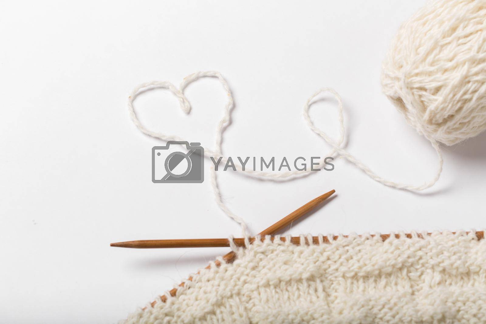 Royalty free image of Ball of yarn and knitting by StudioPeace