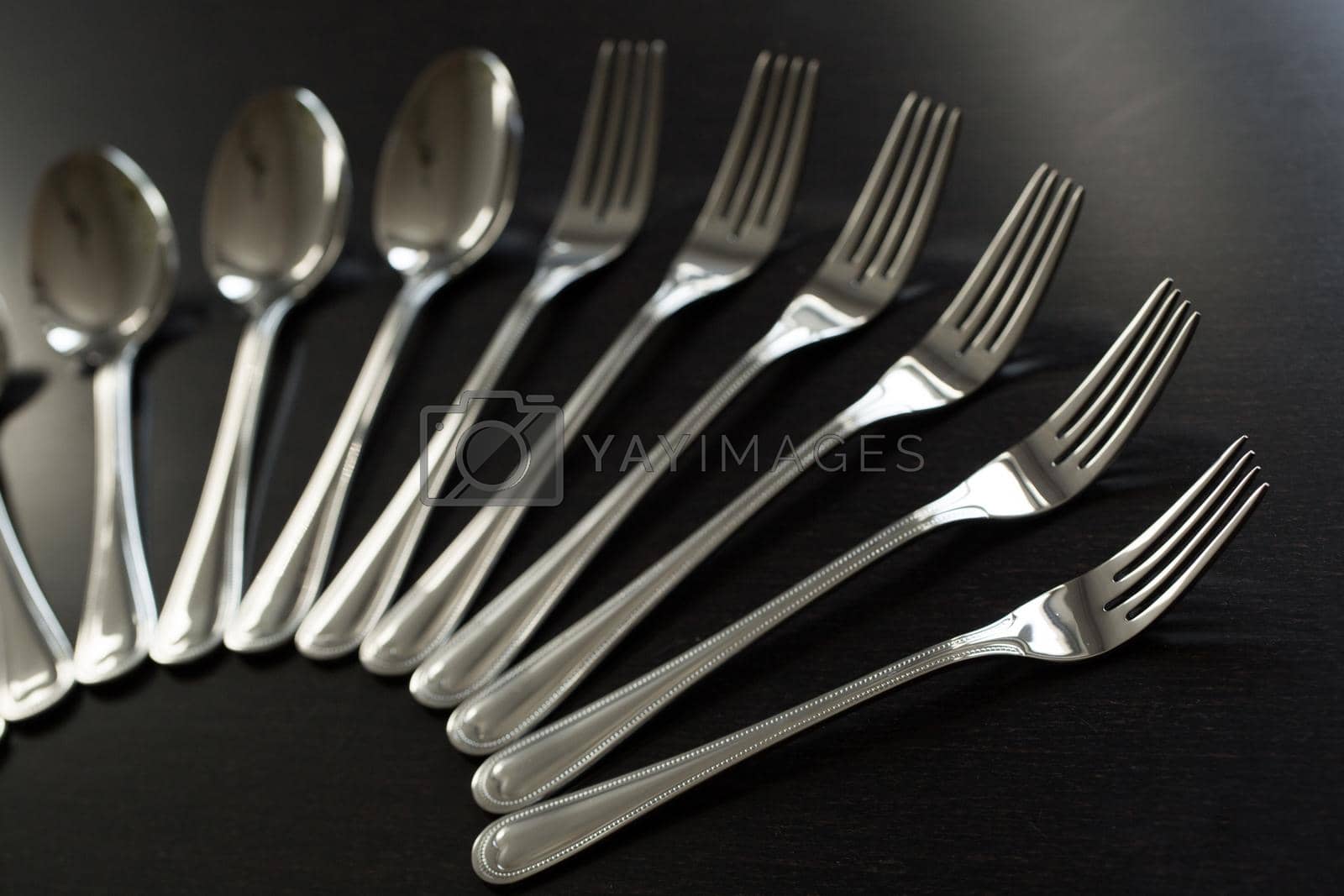 Royalty free image of Cutlery on a black background. Fork, spoon, knife by StudioPeace