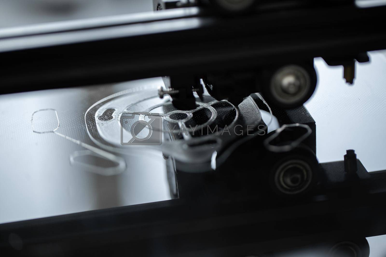 Royalty free image of 3D printing machine operation in the laboratory. by StudioPeace