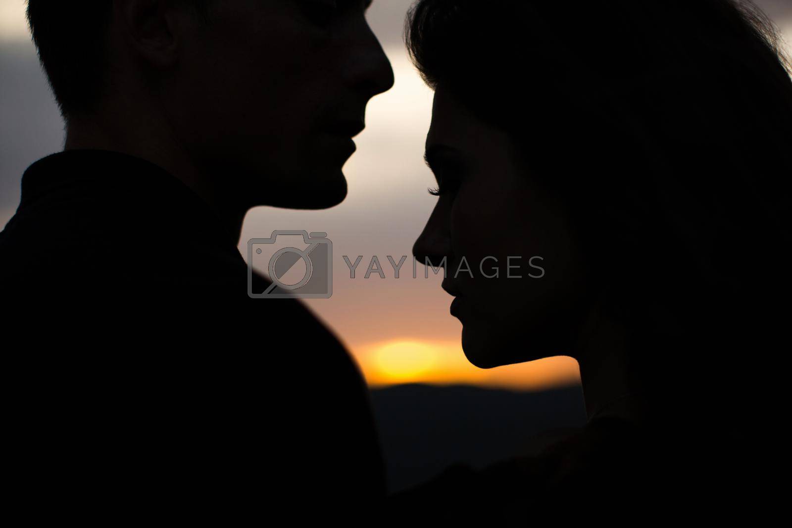 Royalty free image of Silhouette sweethearts at sunset by StudioPeace