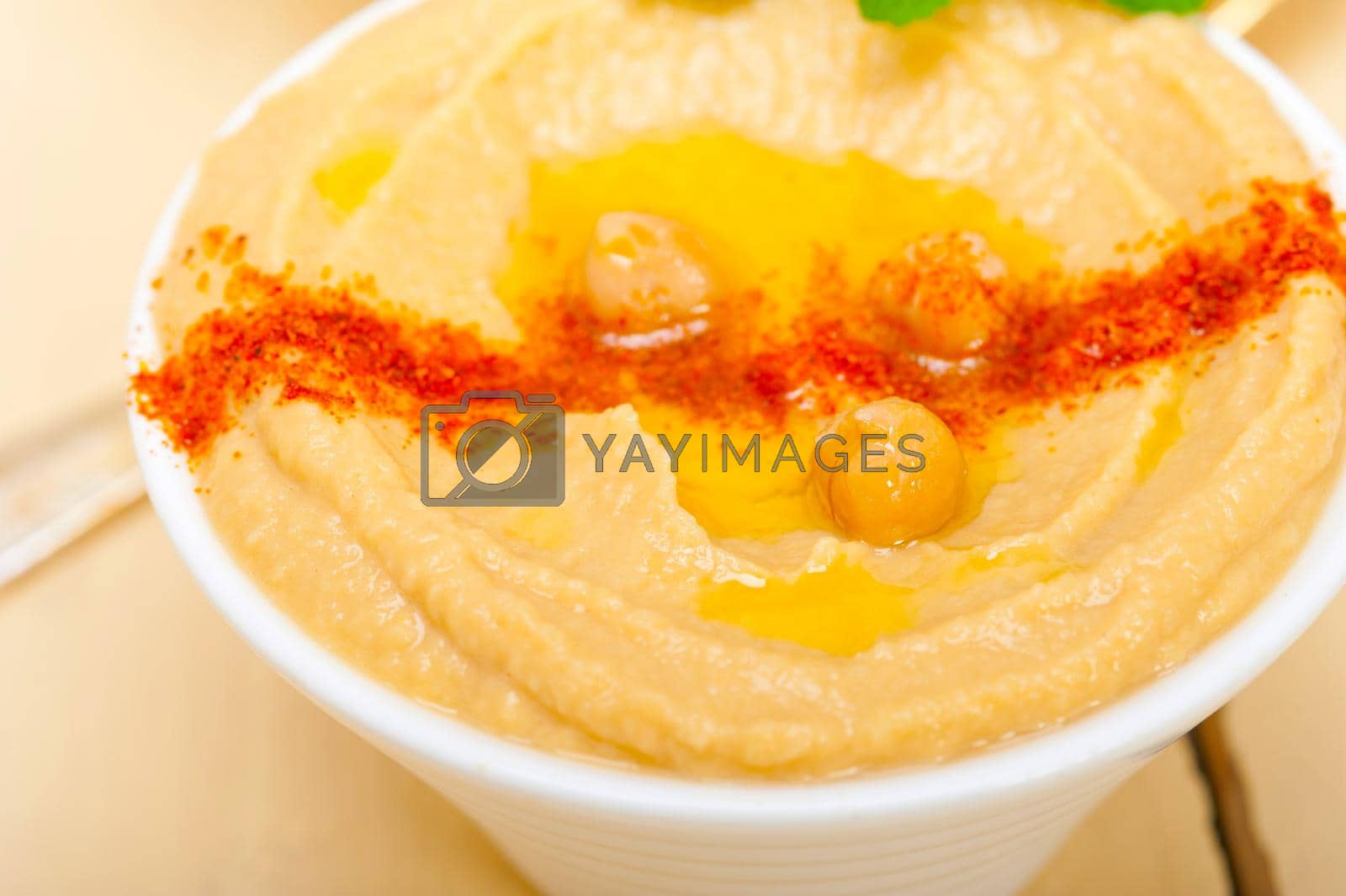 Royalty free image of Hummus with mint on top by keko64