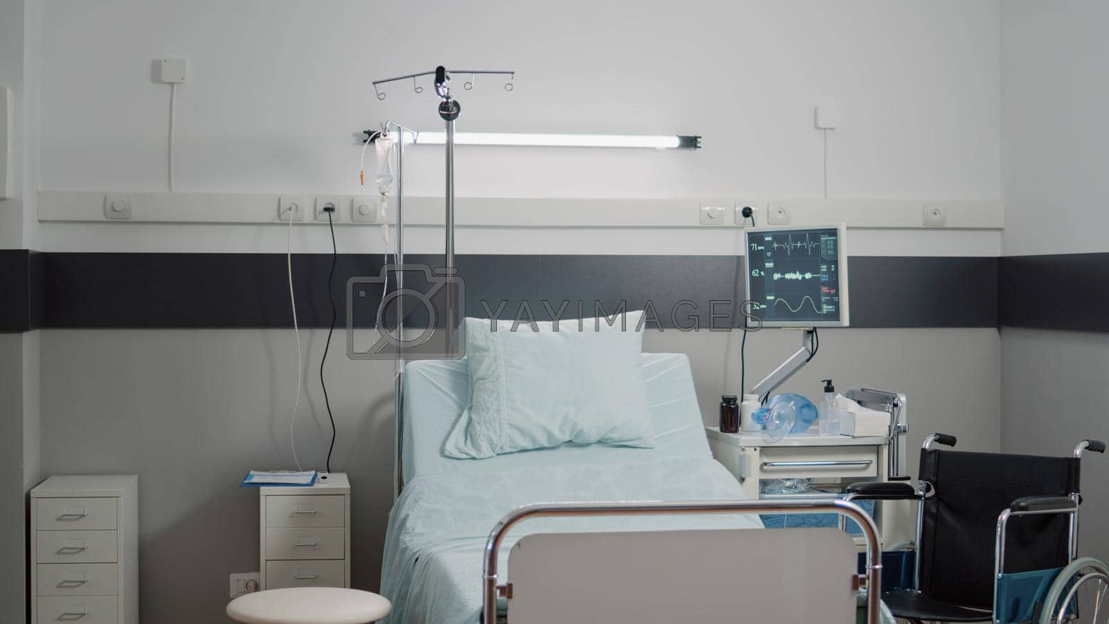 Royalty free image of Nobody in hospital ward with bed for patient healthcare by DCStudio