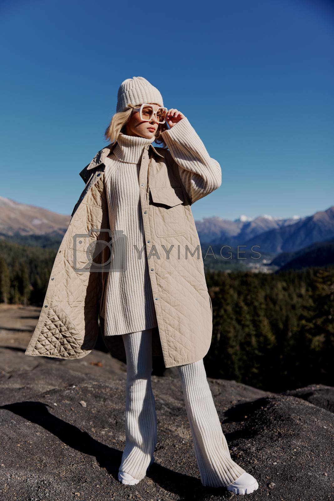 woman fashion glasses mountain top nature freedom relaxation. High quality photo