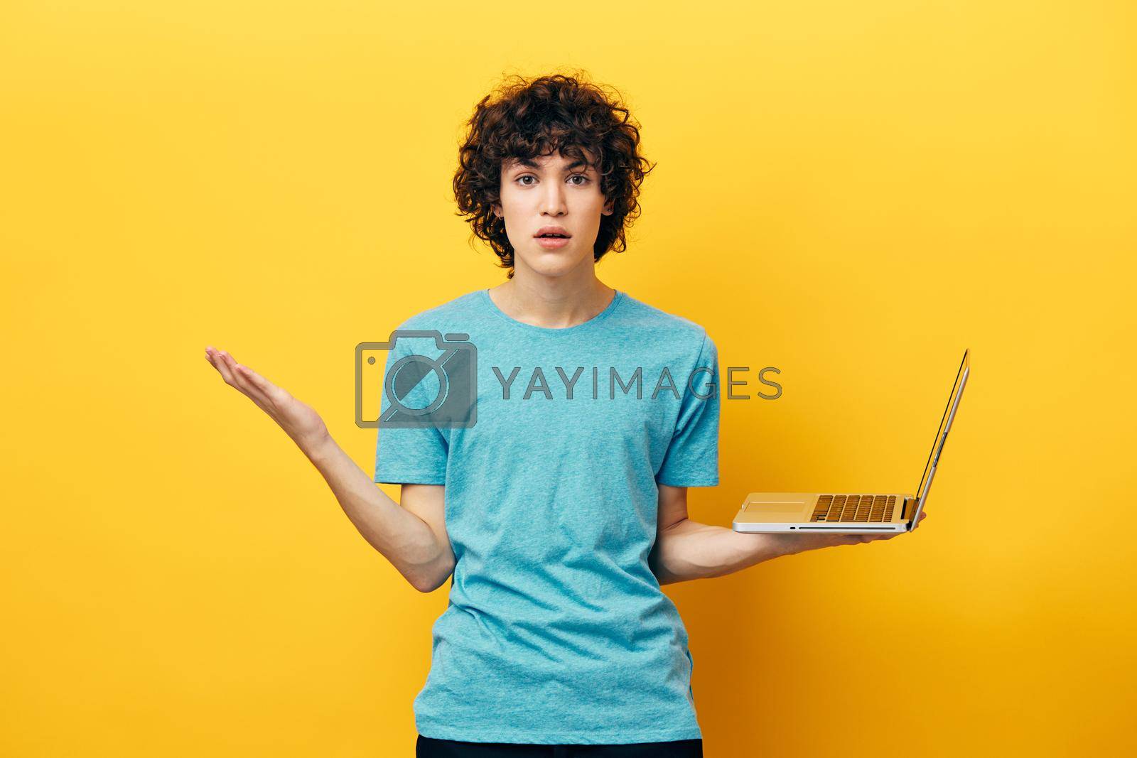 student laptop online chat communication yellow background. High quality photo
