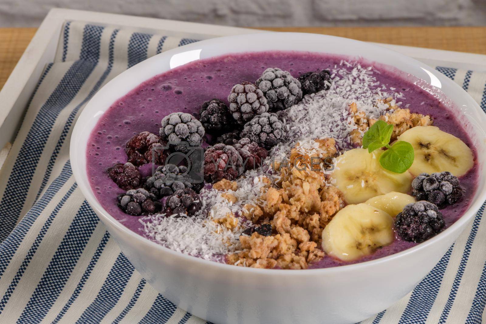 Royalty free image of Blueberry smoothie bowl by homydesign