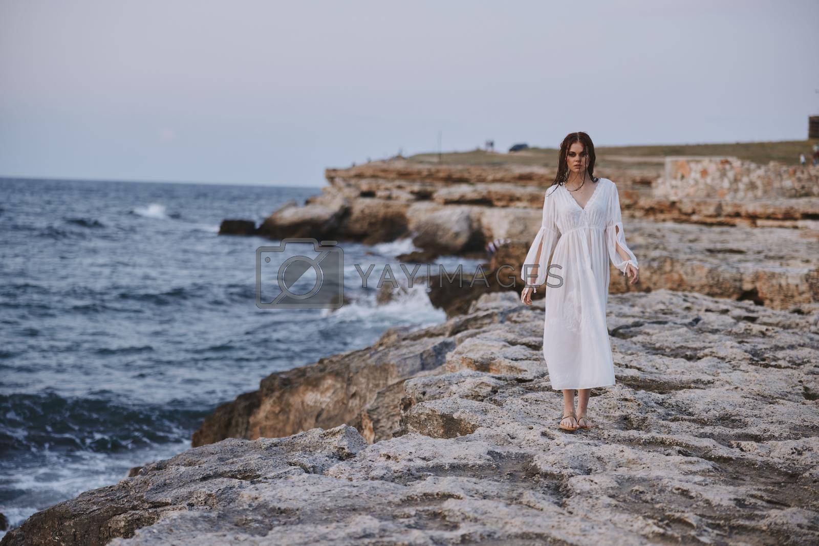 Woman in white dress nature travel lifestyle ocean. High quality photo