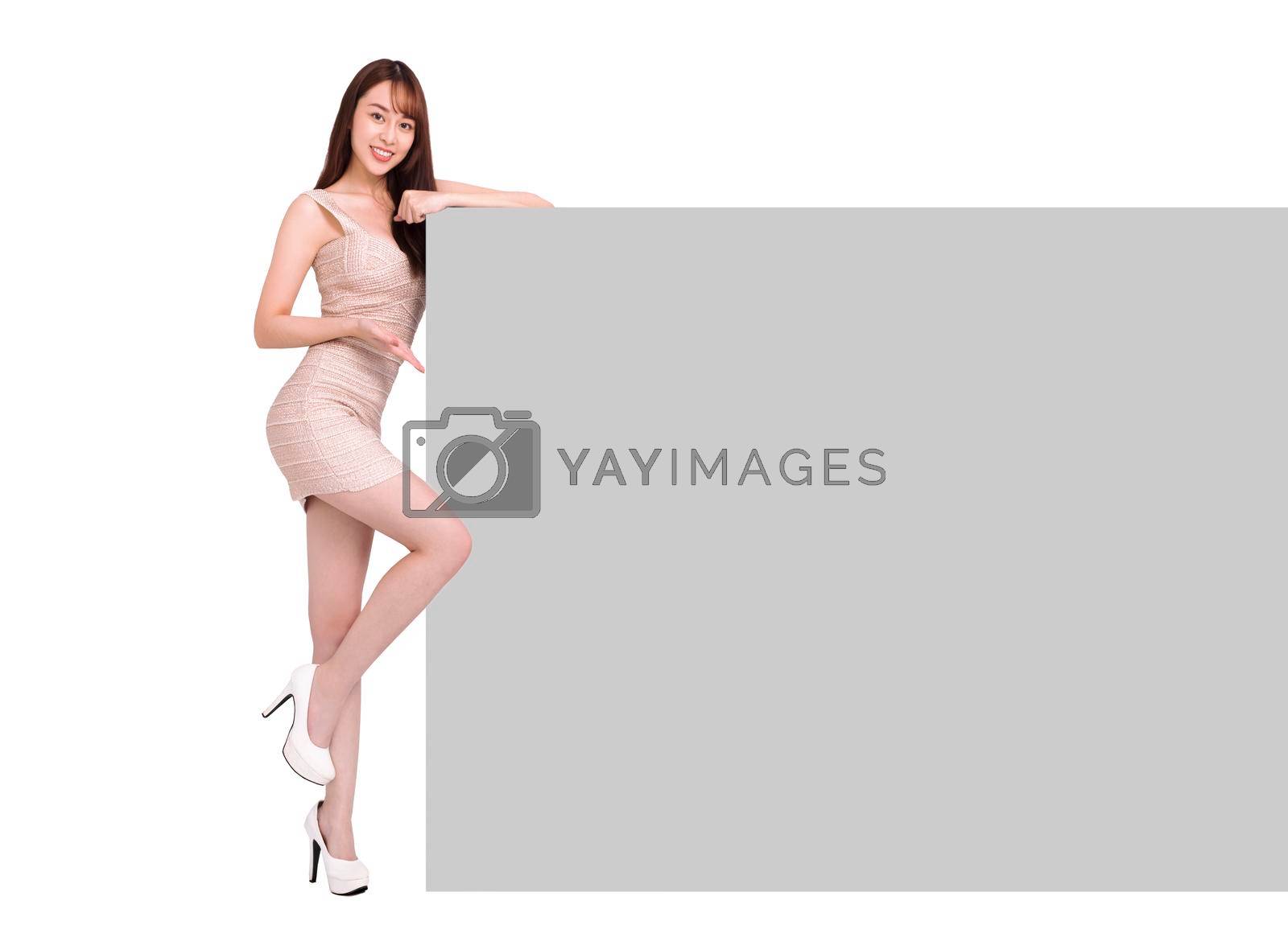Royalty free image of Beautiful Young woman showing the blank billboard sign by tomwang