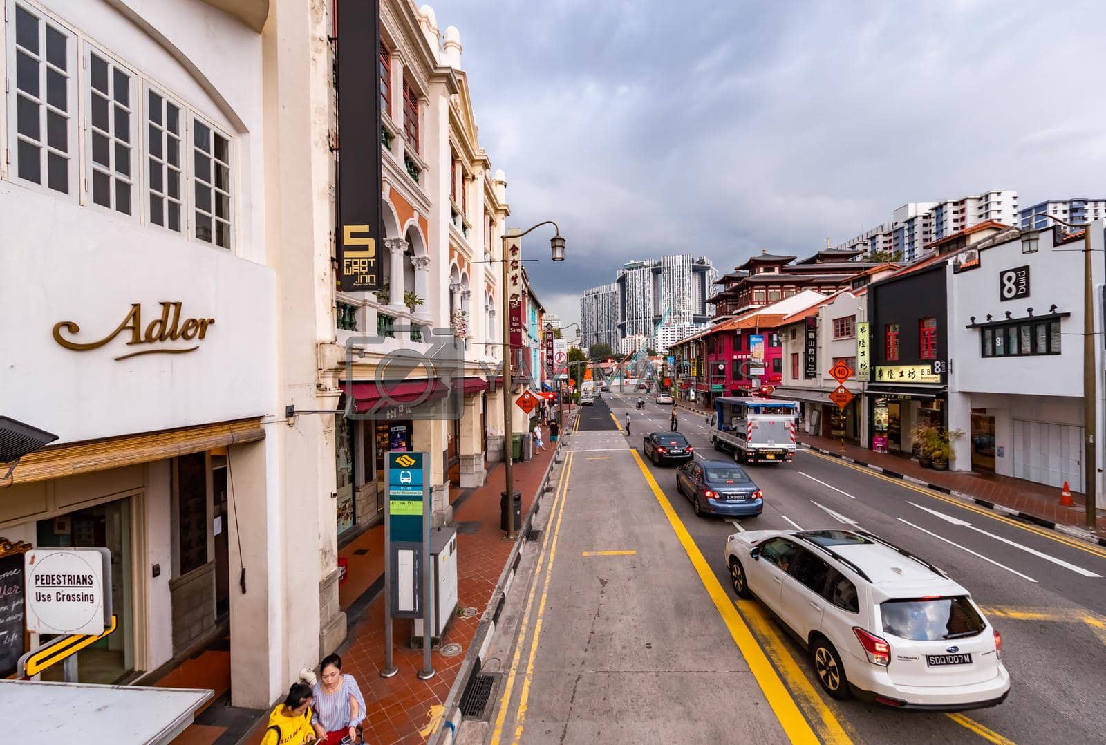 Malaysia, Singapore, 26 March 2018: Singapore's old town in cloudy weather, street with small houses, grocery stores and cafes. High quality photo