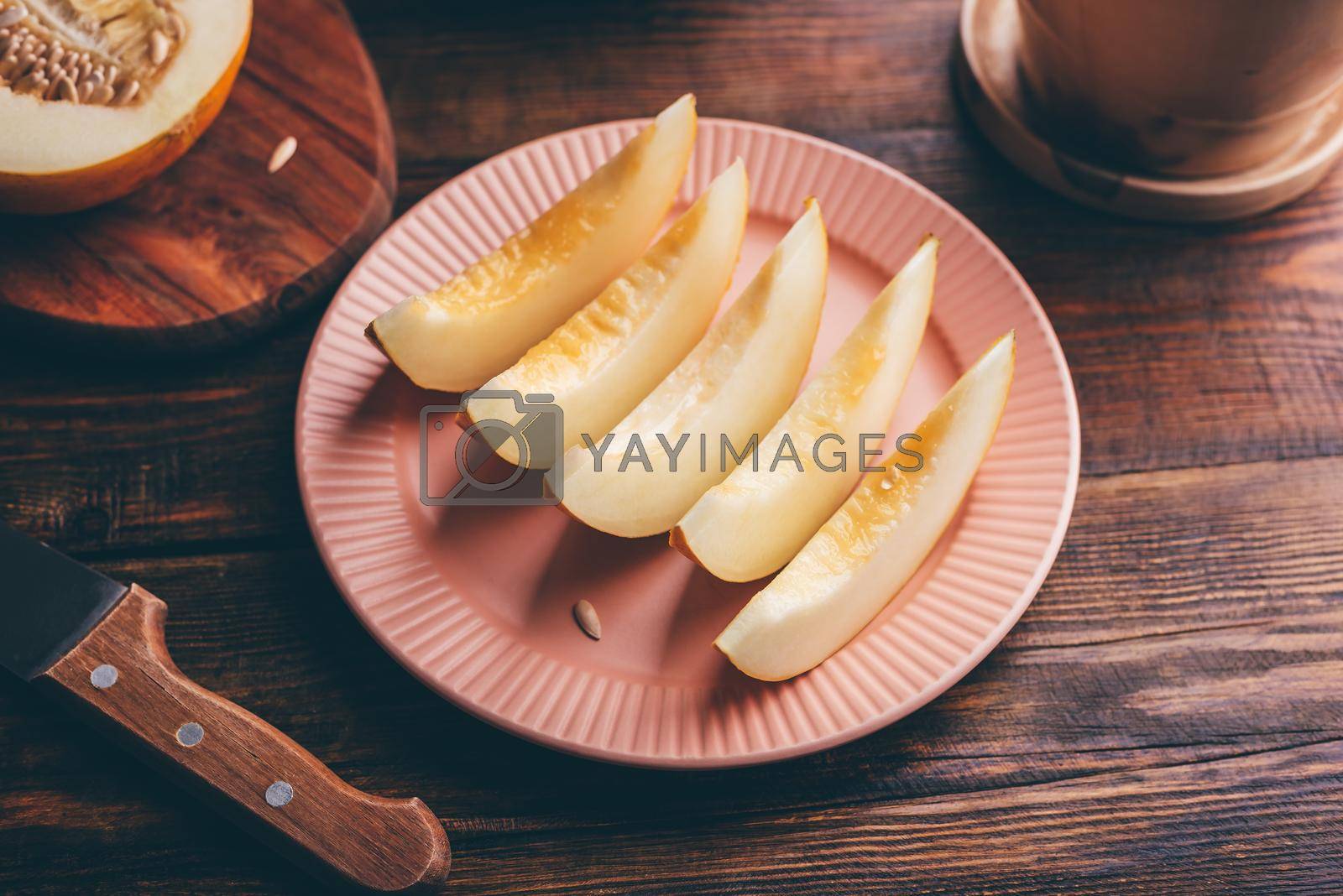 Royalty free image of Sliced Ripe Yellow Melon by Seva_blsv