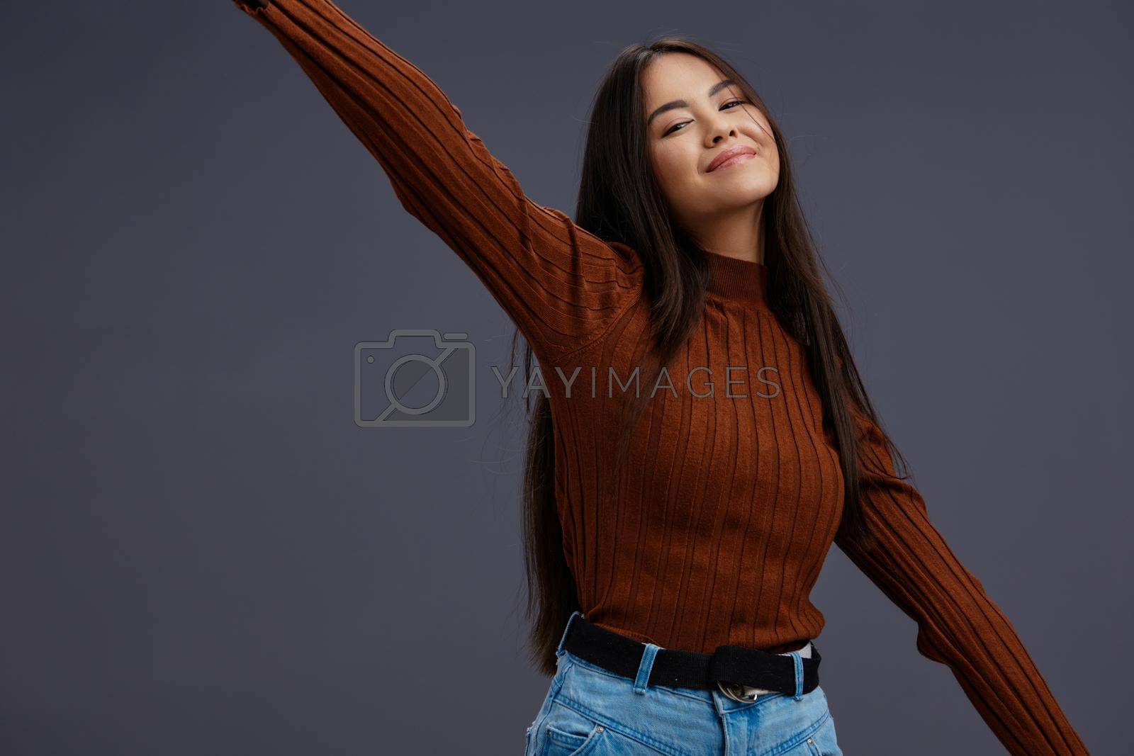 beautiful woman brown sweater glamor posing smile fashion studio model. High quality photo