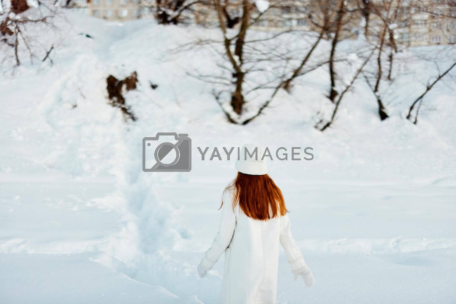 Royalty free image of beautiful woman winter weather snow posing nature rest travel by SHOTPRIME