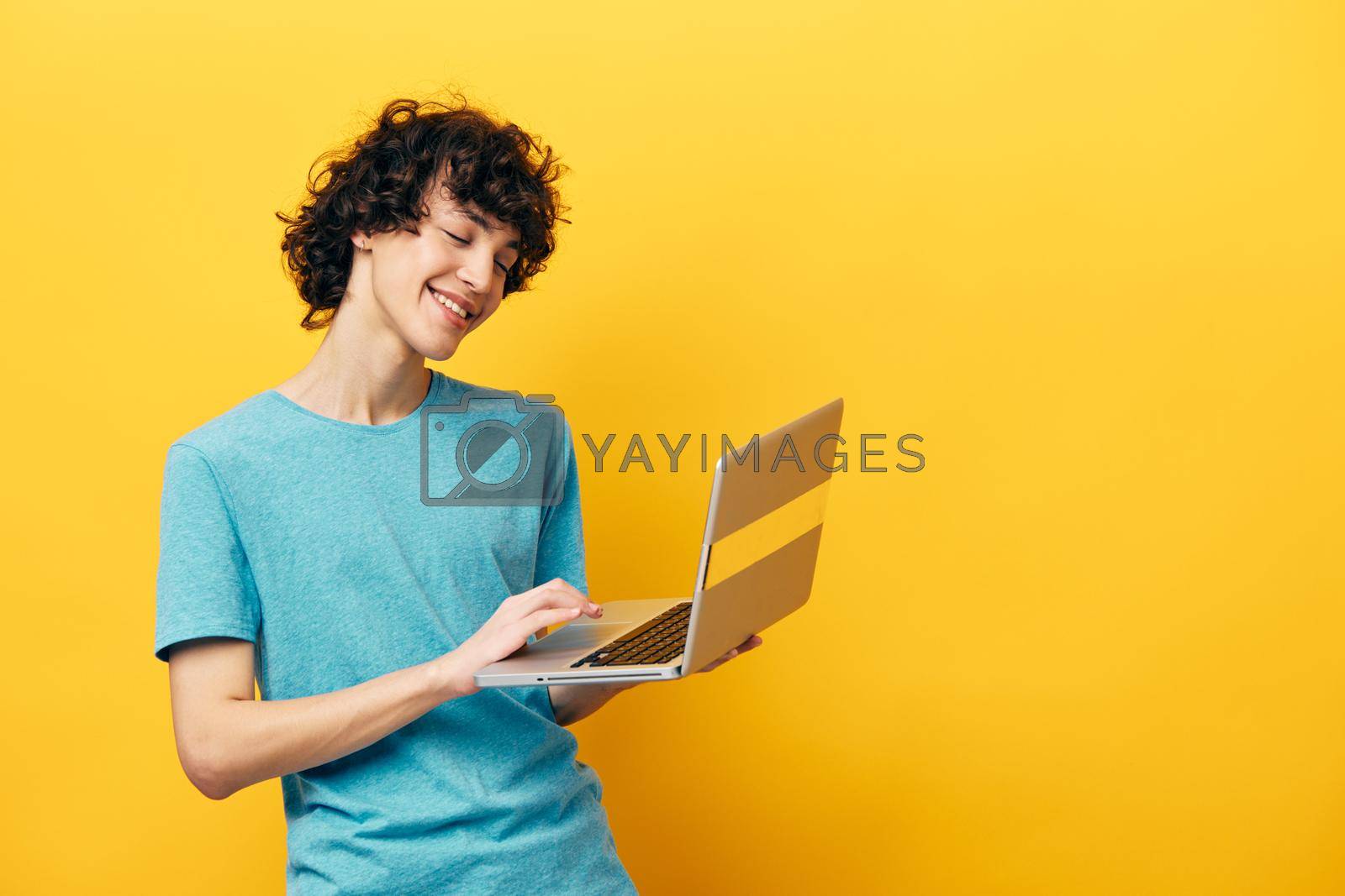 man laptop online chat communication yellow background. High quality photo