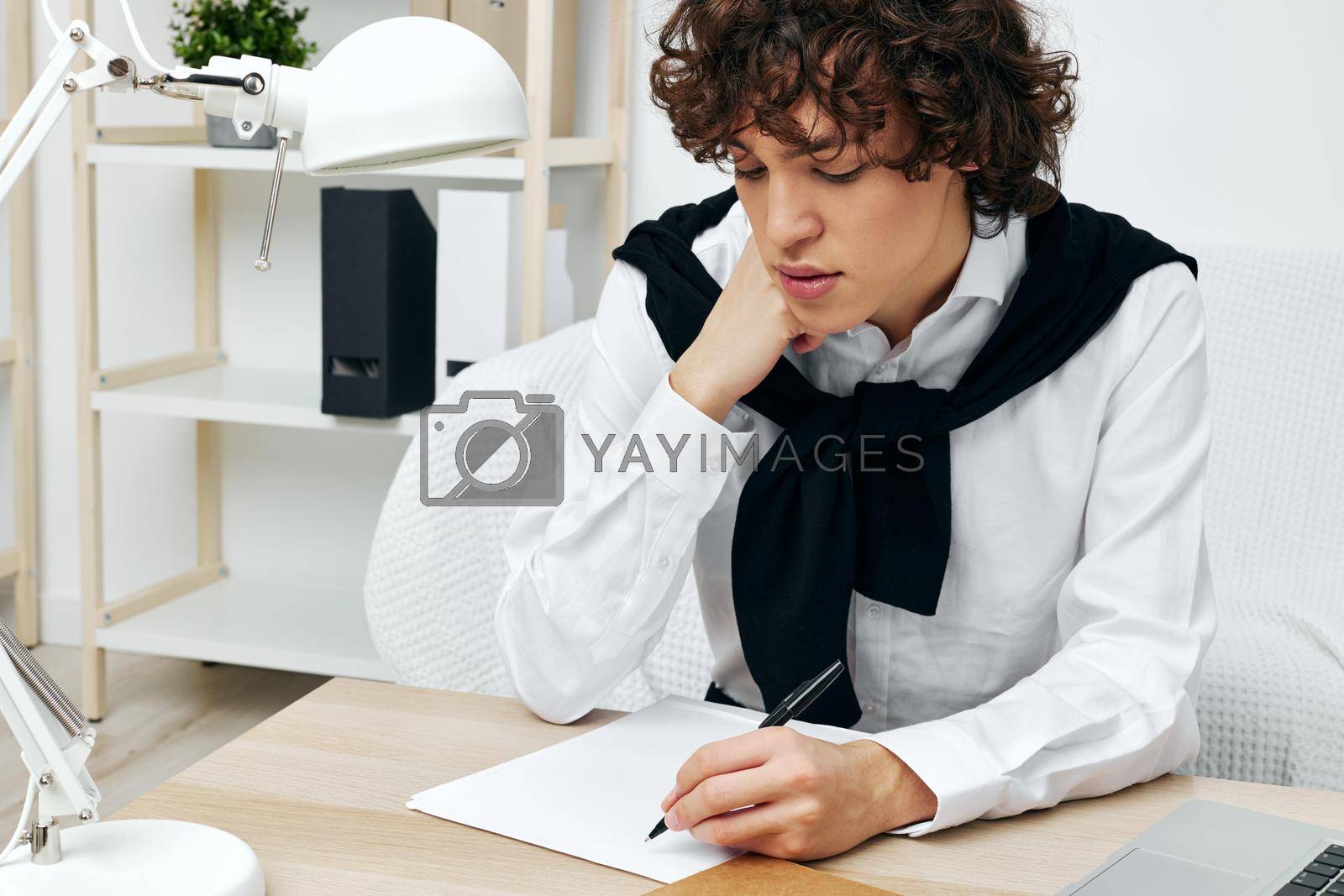 guy laptop sitting on white sofa online training communication. High quality photo
