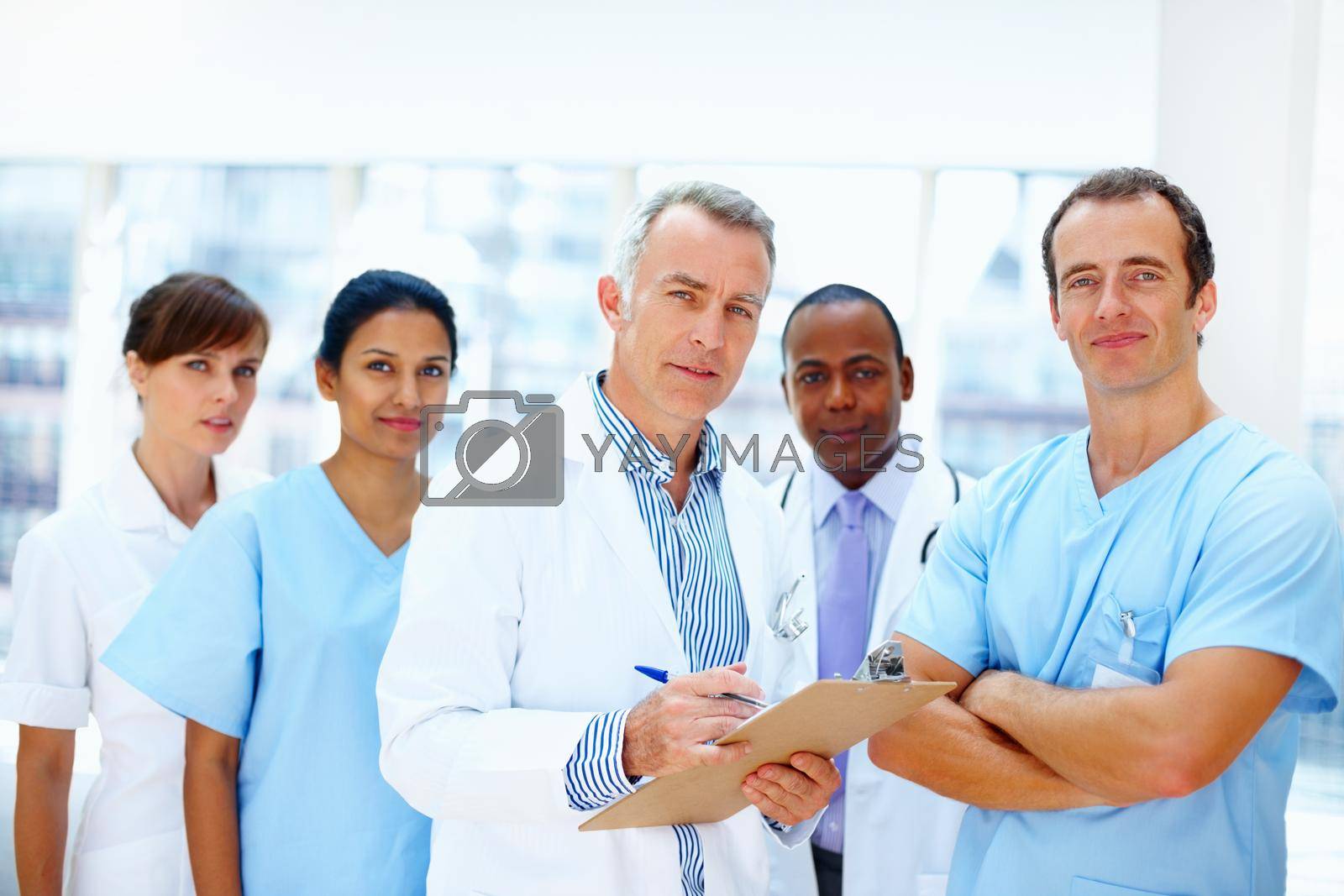 Diverse team of healthcare professionals looking serious.