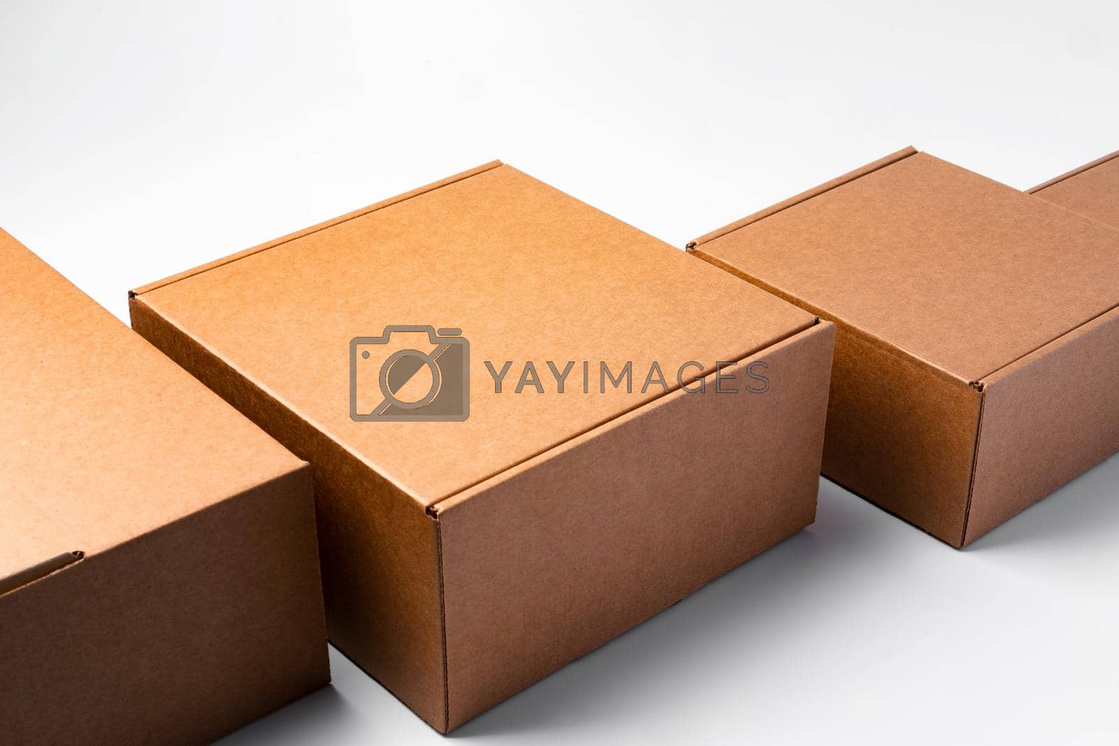 Royalty free image of Lot of cardboard boxes on white background by Fabrikasimf