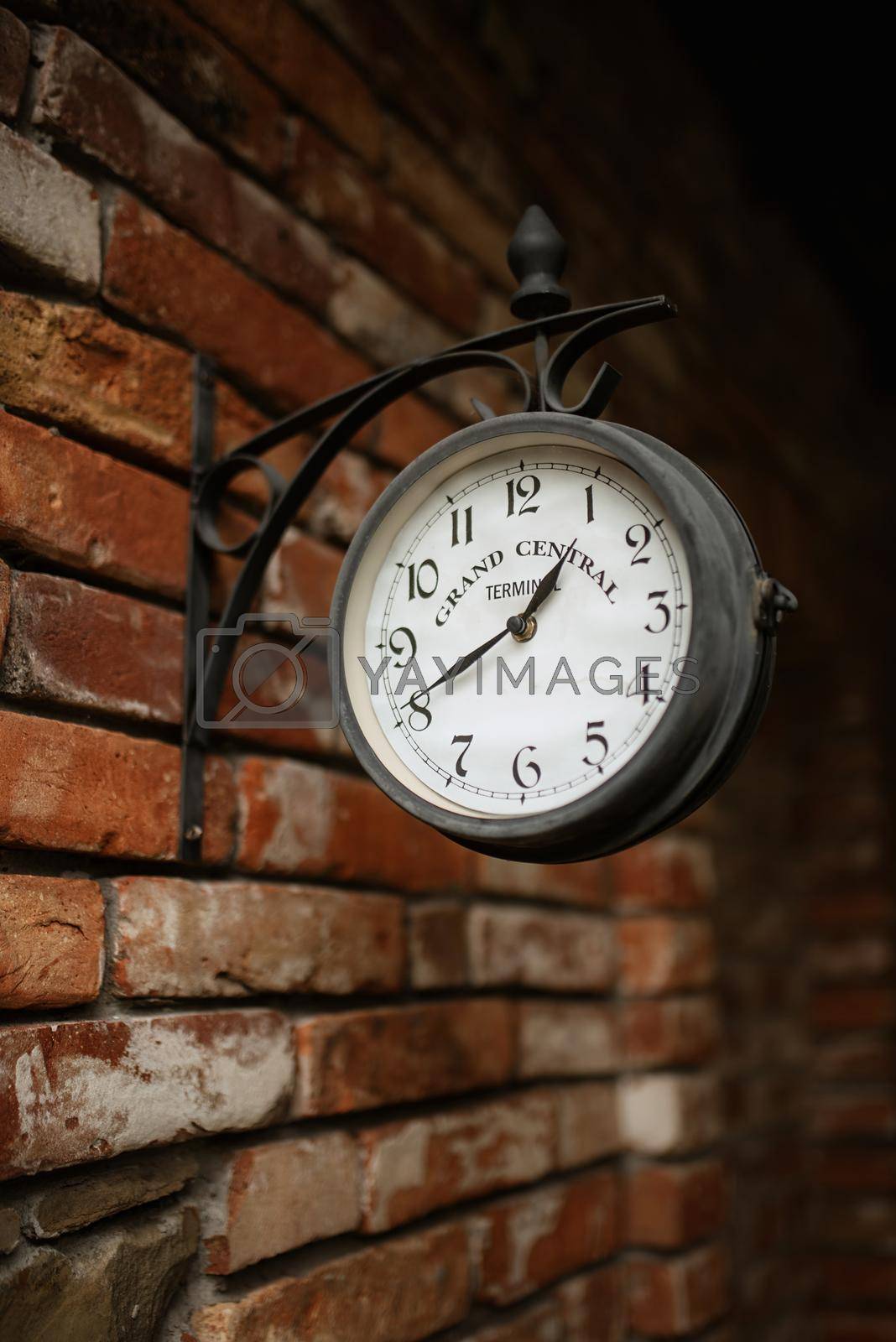 Royalty free image of old station clock by Andreua