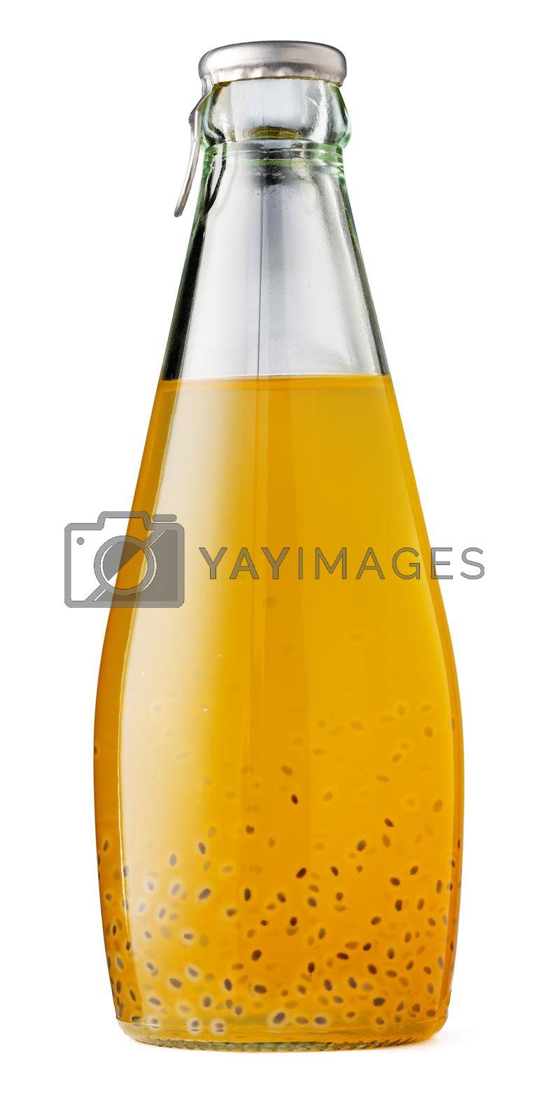 Drink with basil seeds in a glass bottle isolated on white background