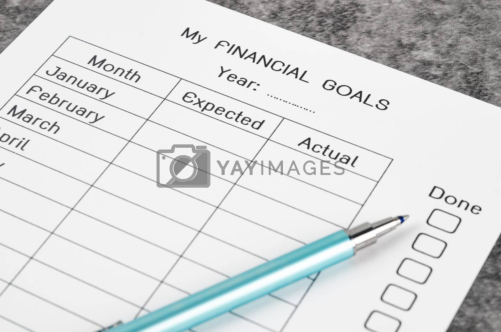 My planning financial goals form and pen.