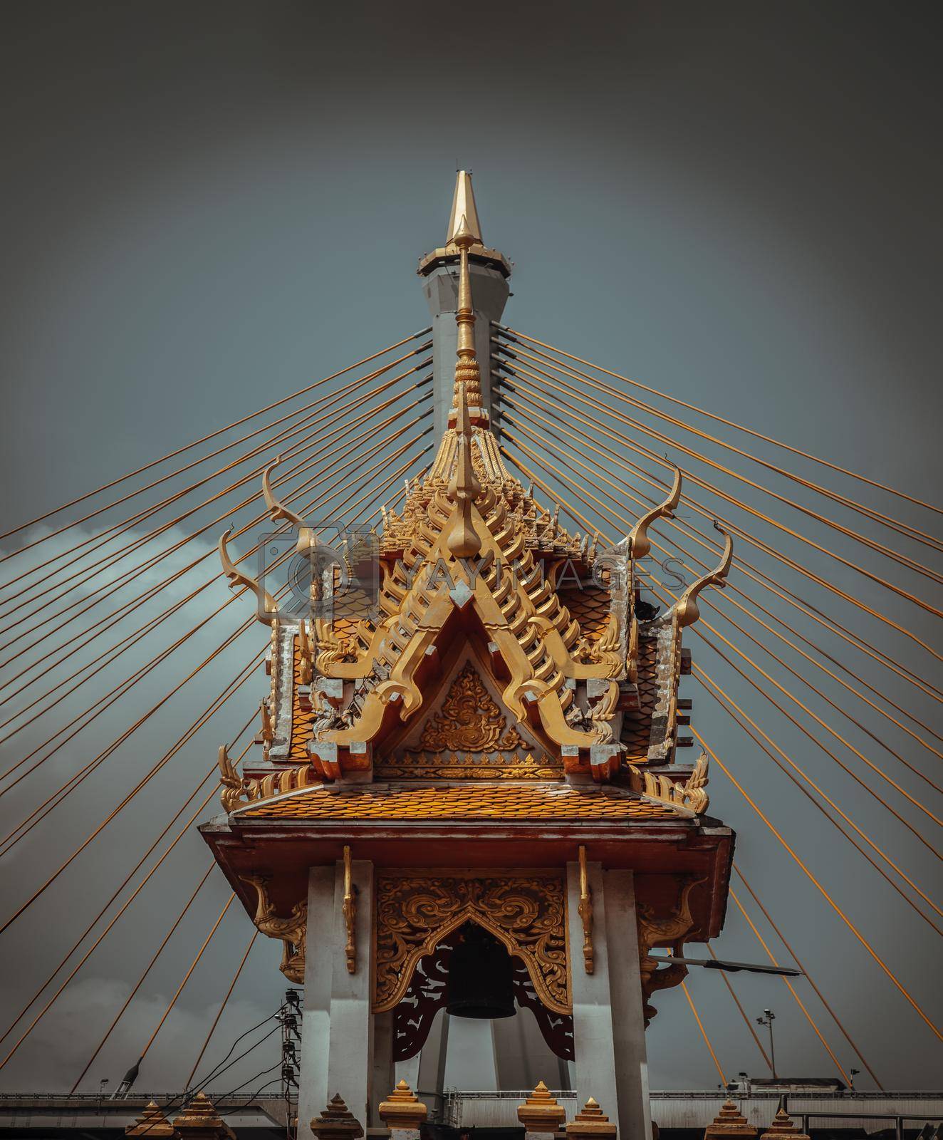 Bangkok, Thailand. Mar - 12, 2022 : Beautiful of Buddhist temple with suspension bridge background. Selective focus.