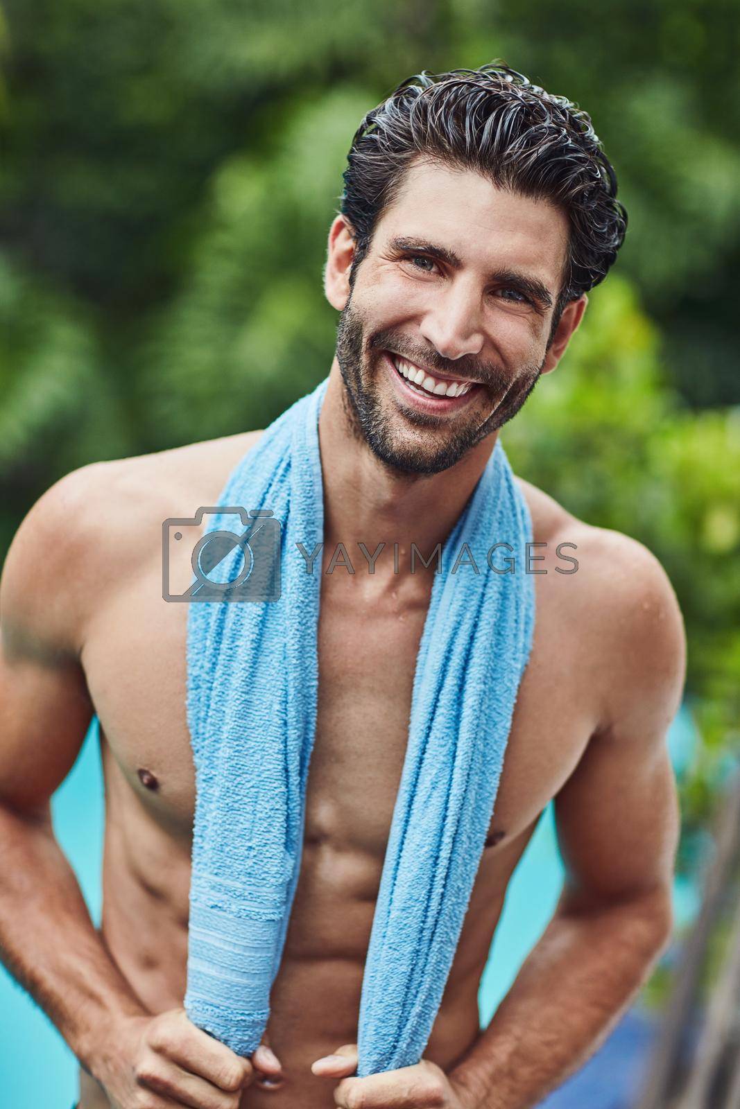 Royalty free image of I always feel happy after a swim. Portrait of a handsome young man who just go out the swimming pool at home. by YuriArcurs
