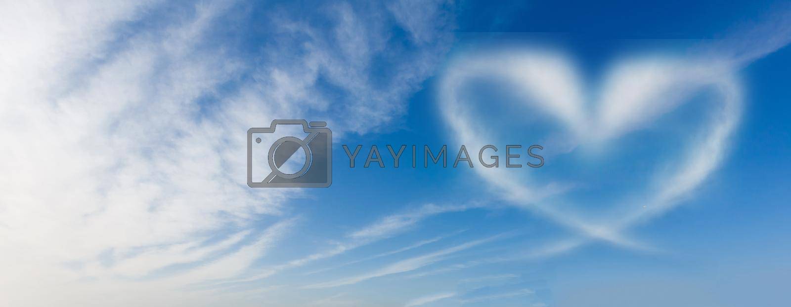 blue sky with hearts shape clouds. Beauty natural background.