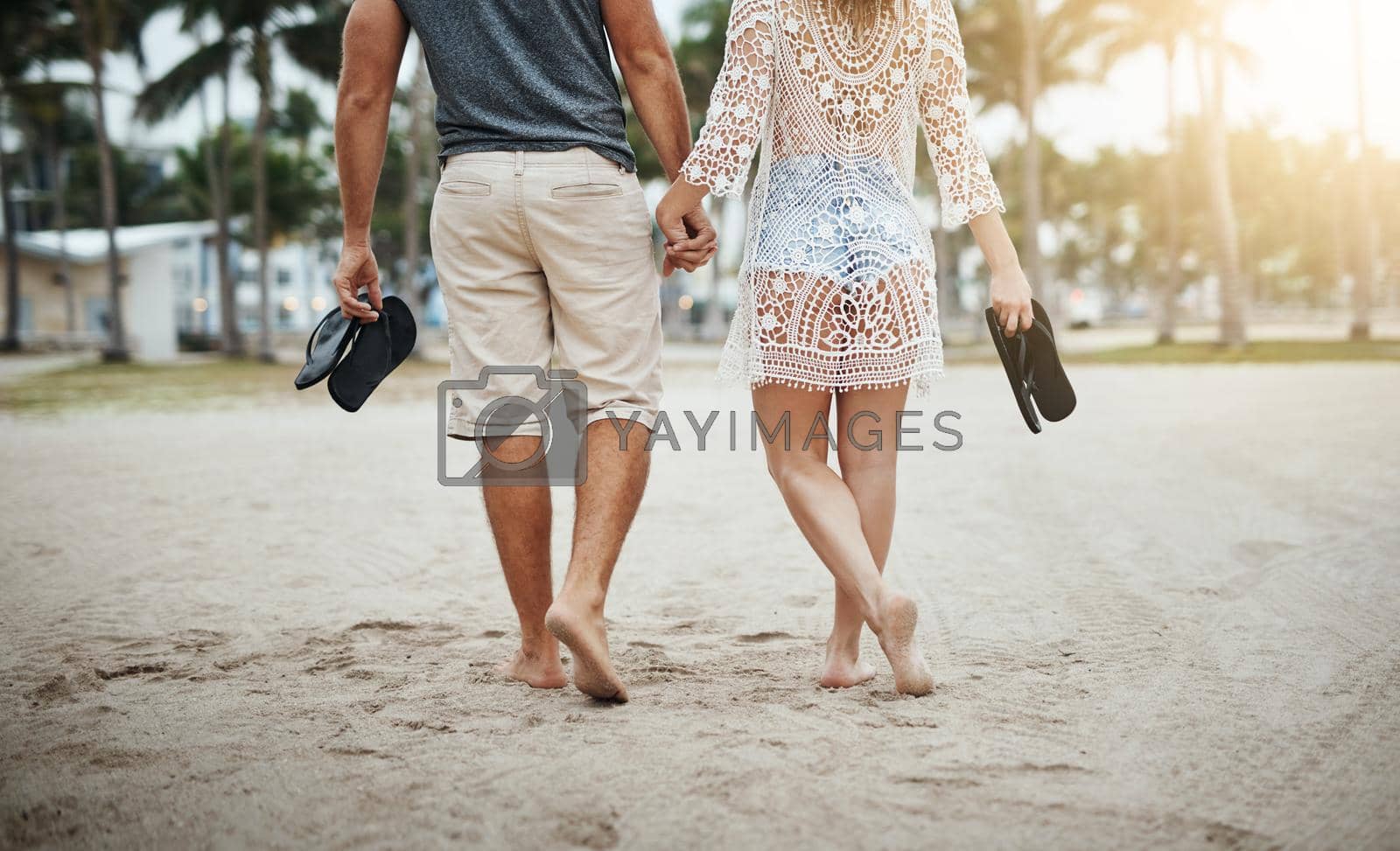 Cropped shot of a young couple spending a romantic day at the beach.