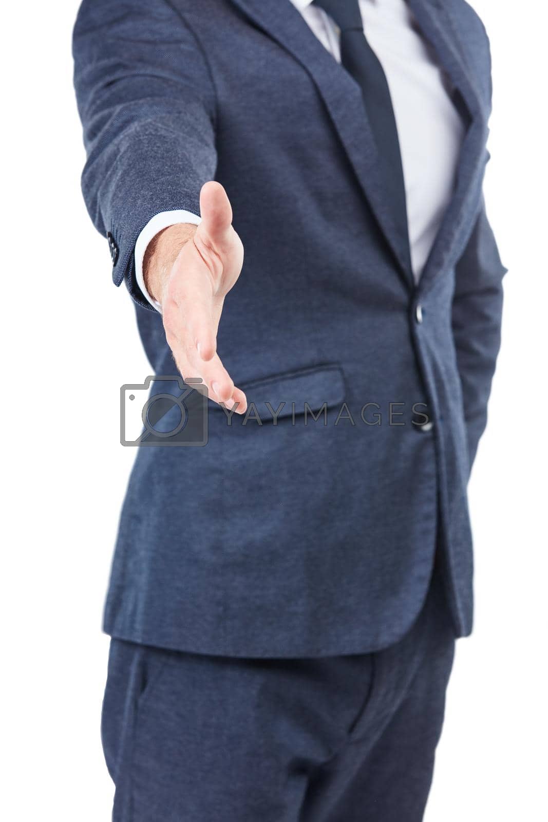 Royalty free image of I have a great deal for you. Studio shot of an unrecognizable businessman reaching in for a handshake. by YuriArcurs