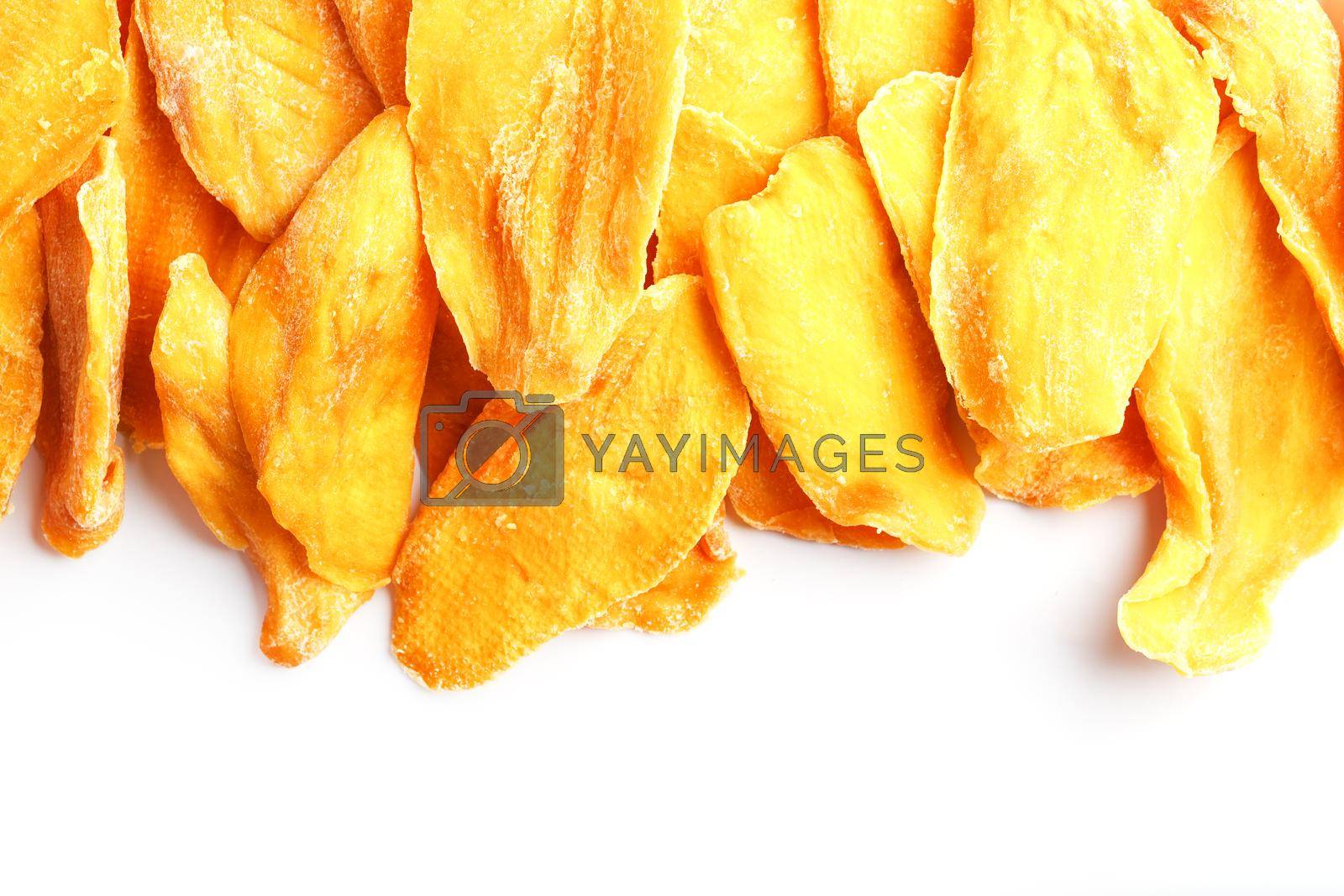 Royalty free image of Dried mango sliced on a white background with free space by AlexGrec