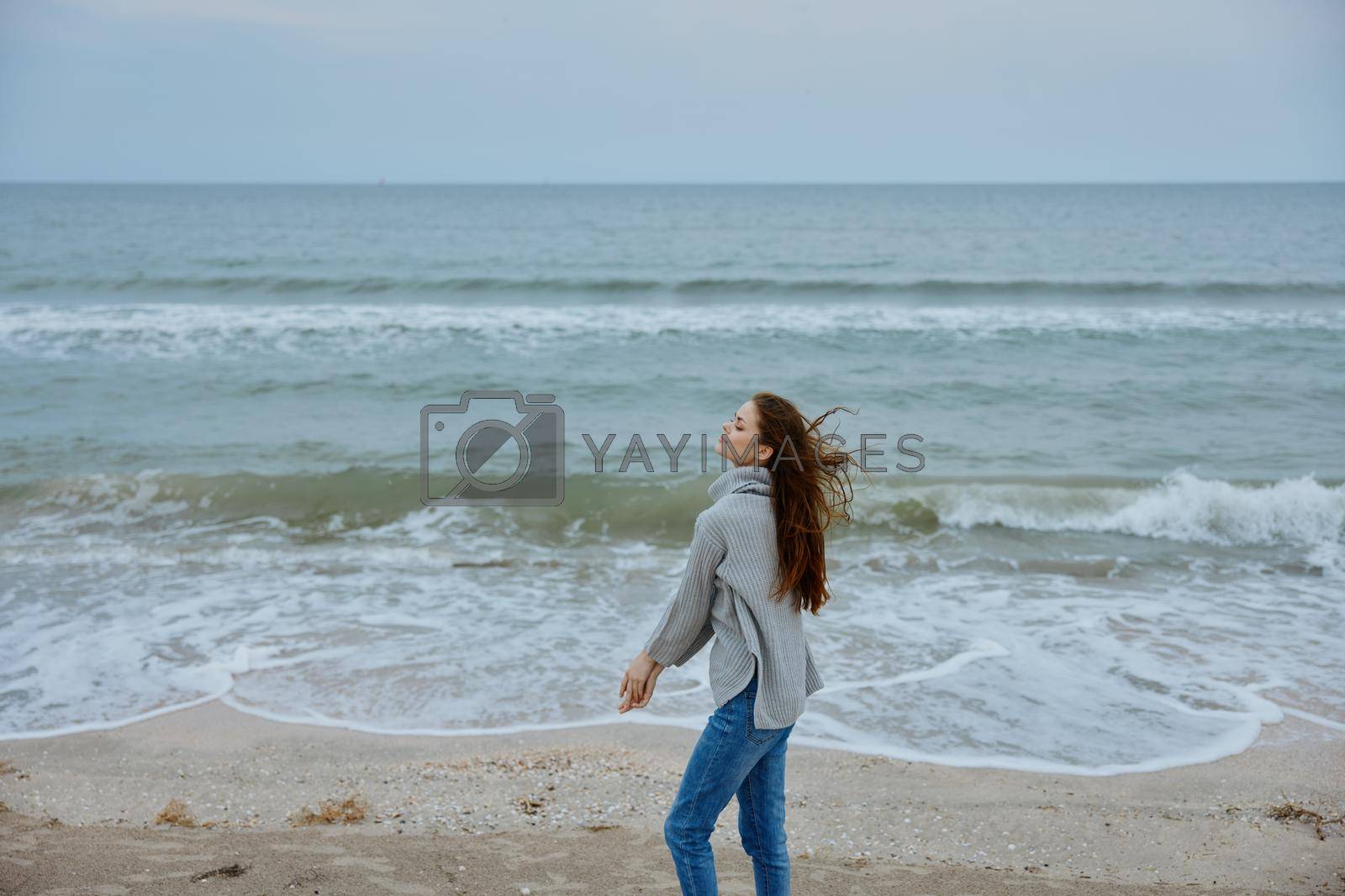 cheerful woman sand beach walk ocean freedom travel Happy female relaxing. High quality photo