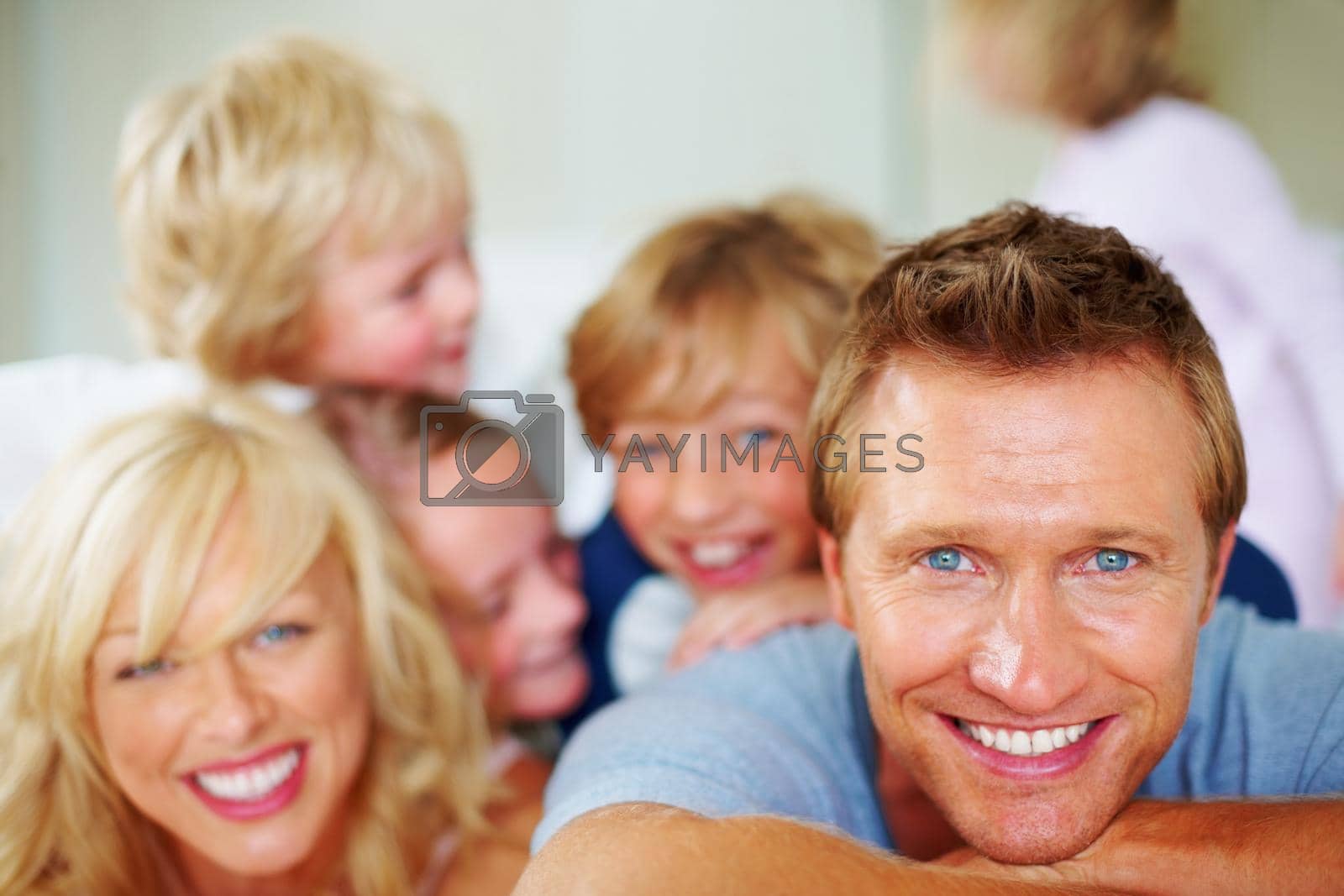 Portrait of a happy mature man with his family enjoying together.
