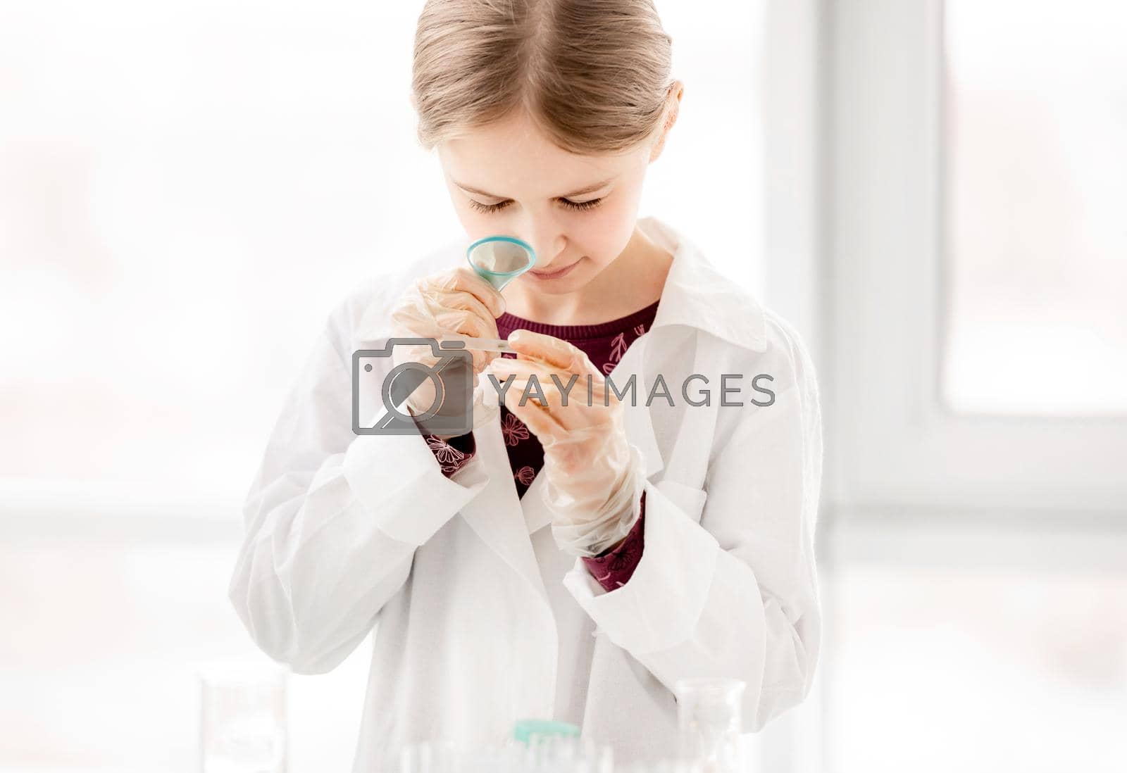 Royalty free image of Girl on chemistry lesson by tan4ikk1