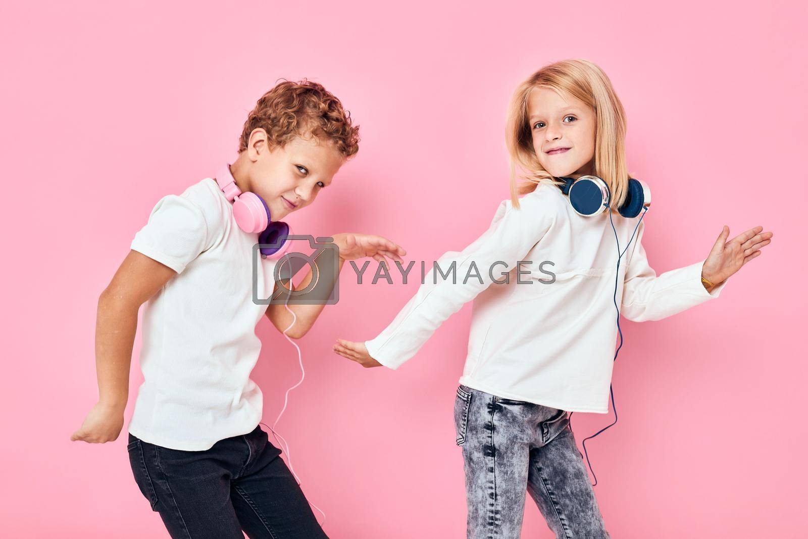 Active young people dancing with headphones entertainment isolated background. High quality photo