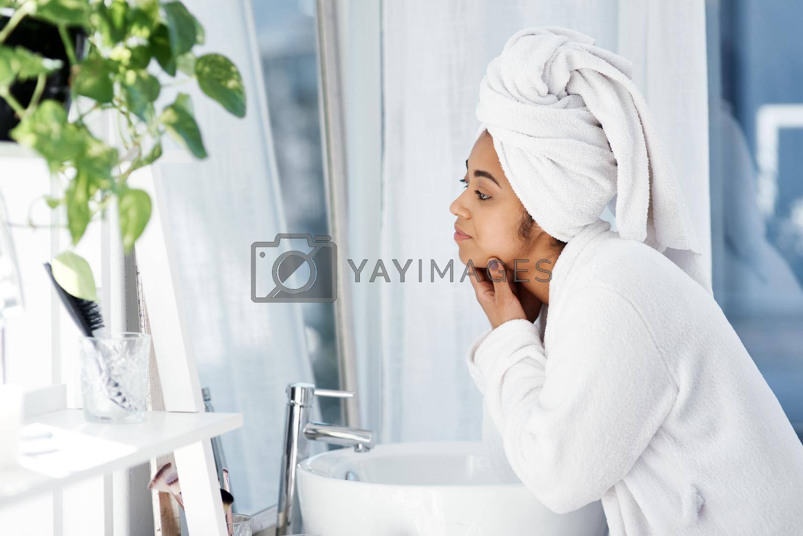 Shot of a young woman going through her beauty routine at home.