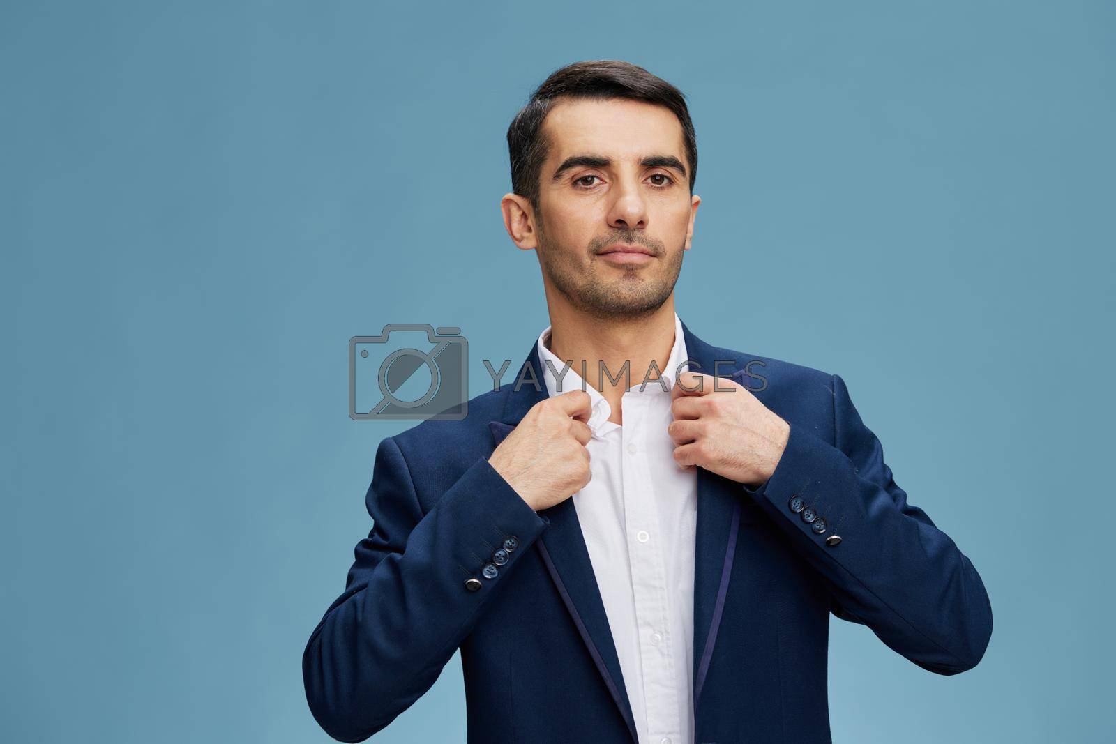 manager blue suit adjusting his jacket business and office concept. High quality photo