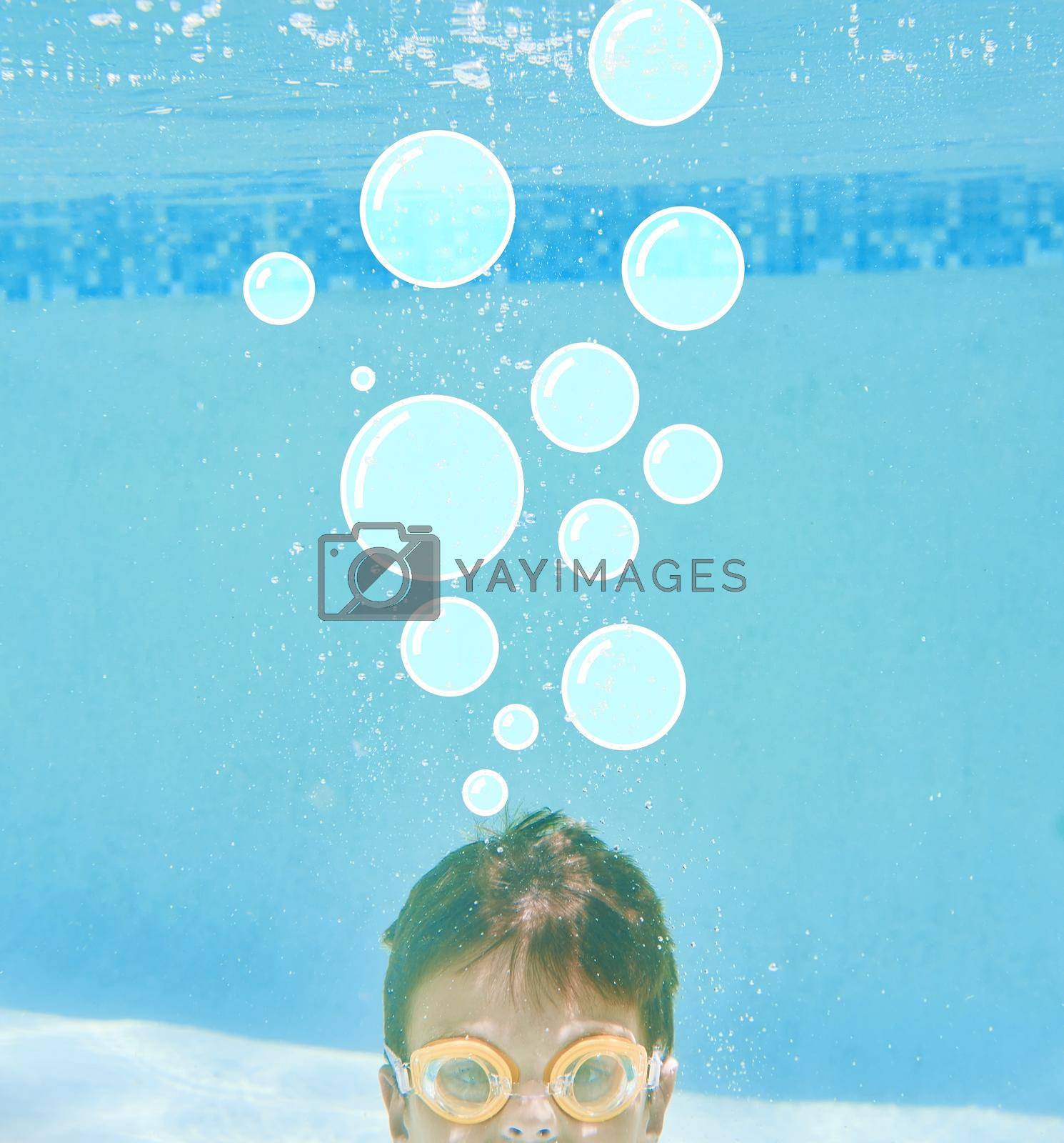 Royalty free image of Whats on your mind. Shot of a little boy swimming underwater with bubbles above his head. by YuriArcurs
