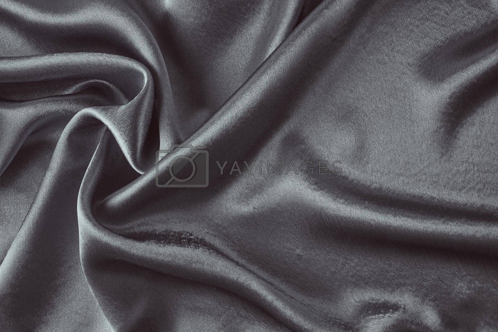 Dark silk background with folds. Abstract texture of rippled satin surface