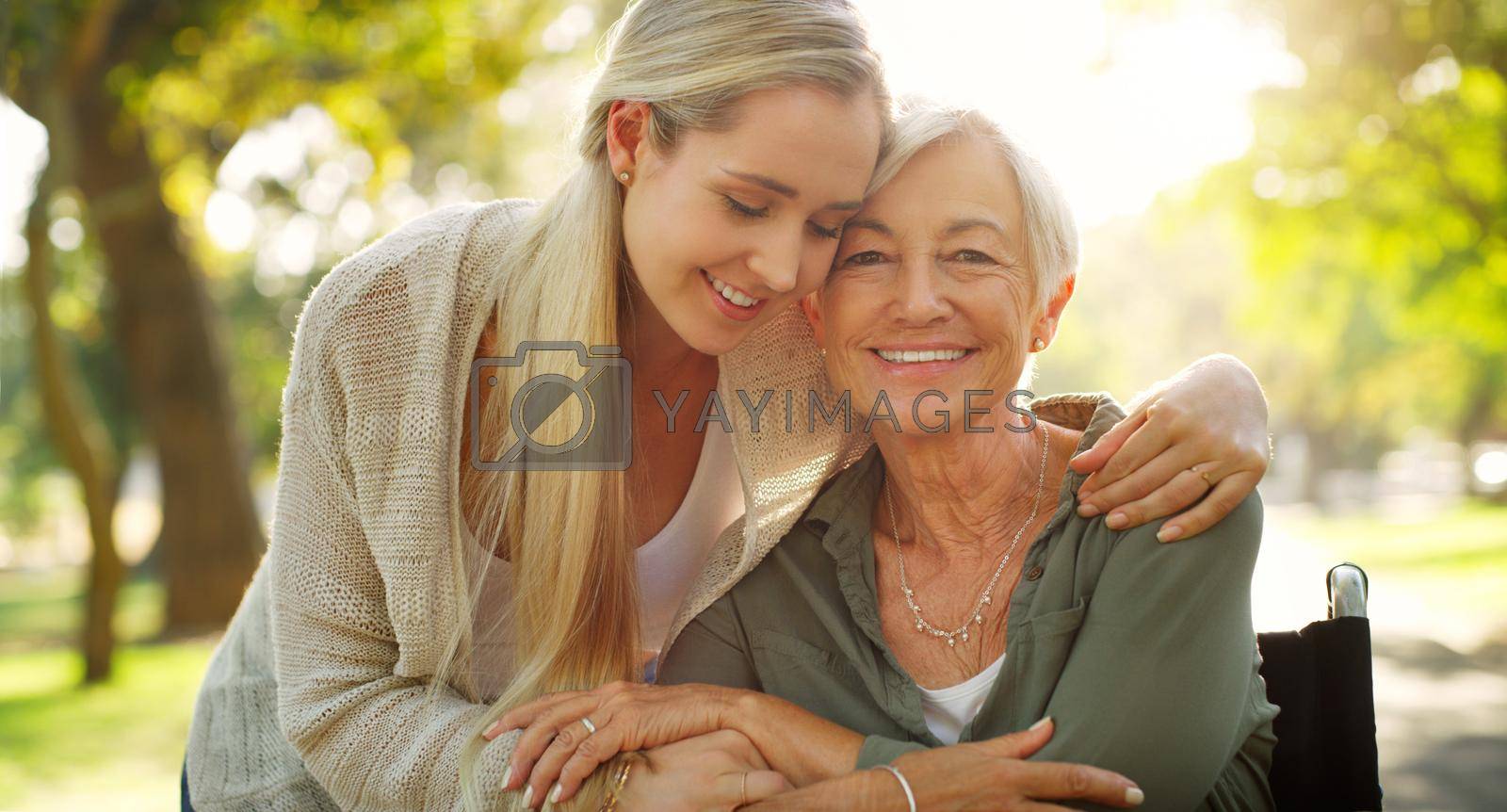 Cropped shot of an affectionate young woman embracing her aged mother at the park.