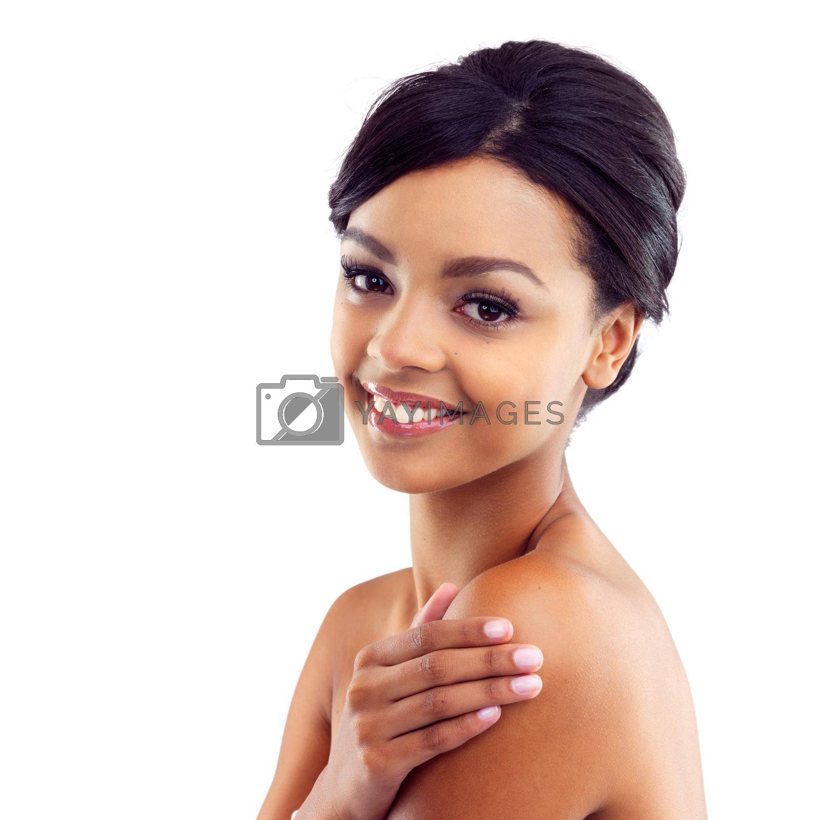 Studio portrait of a young woman with perfect skin posing against a white background.