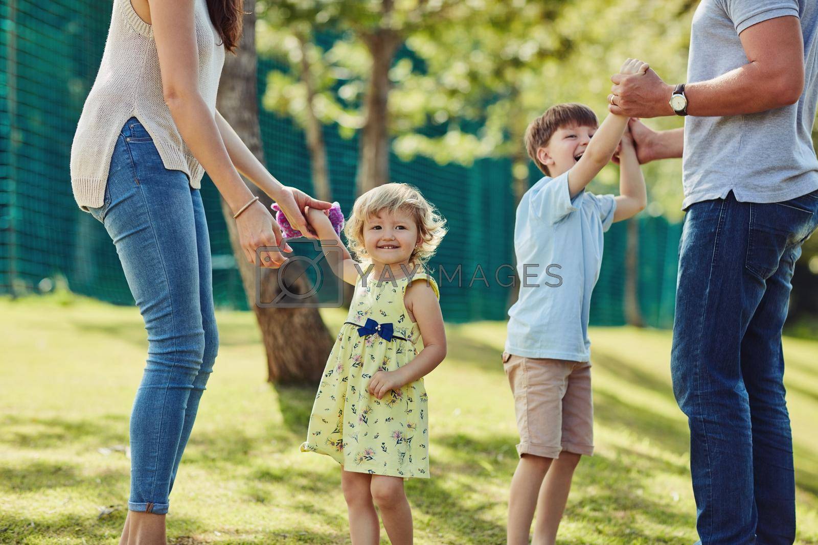 Shot of a happy family bonding together outdoors.